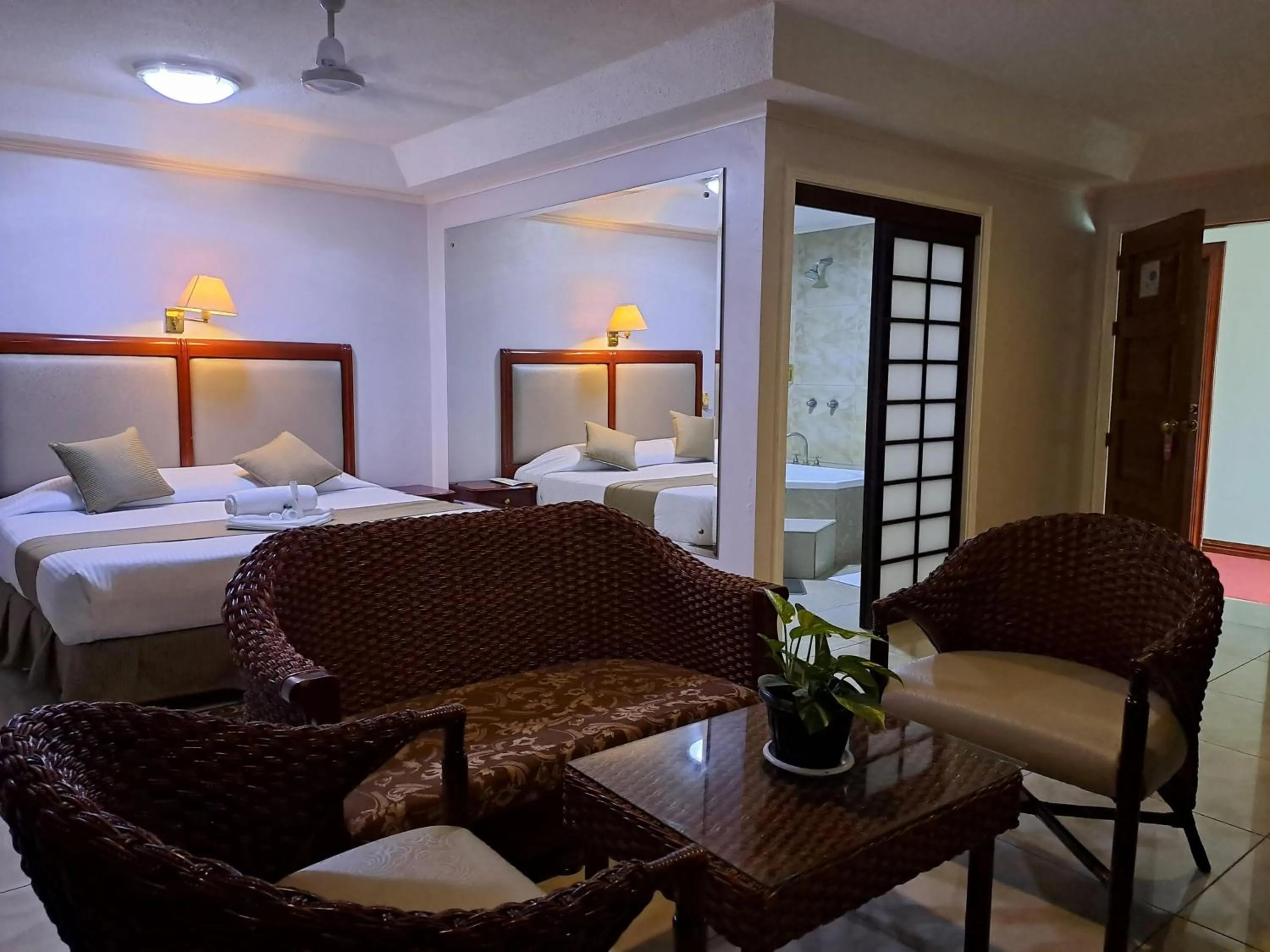 Photo of the whole room, Bed in Wild Orchid Resort