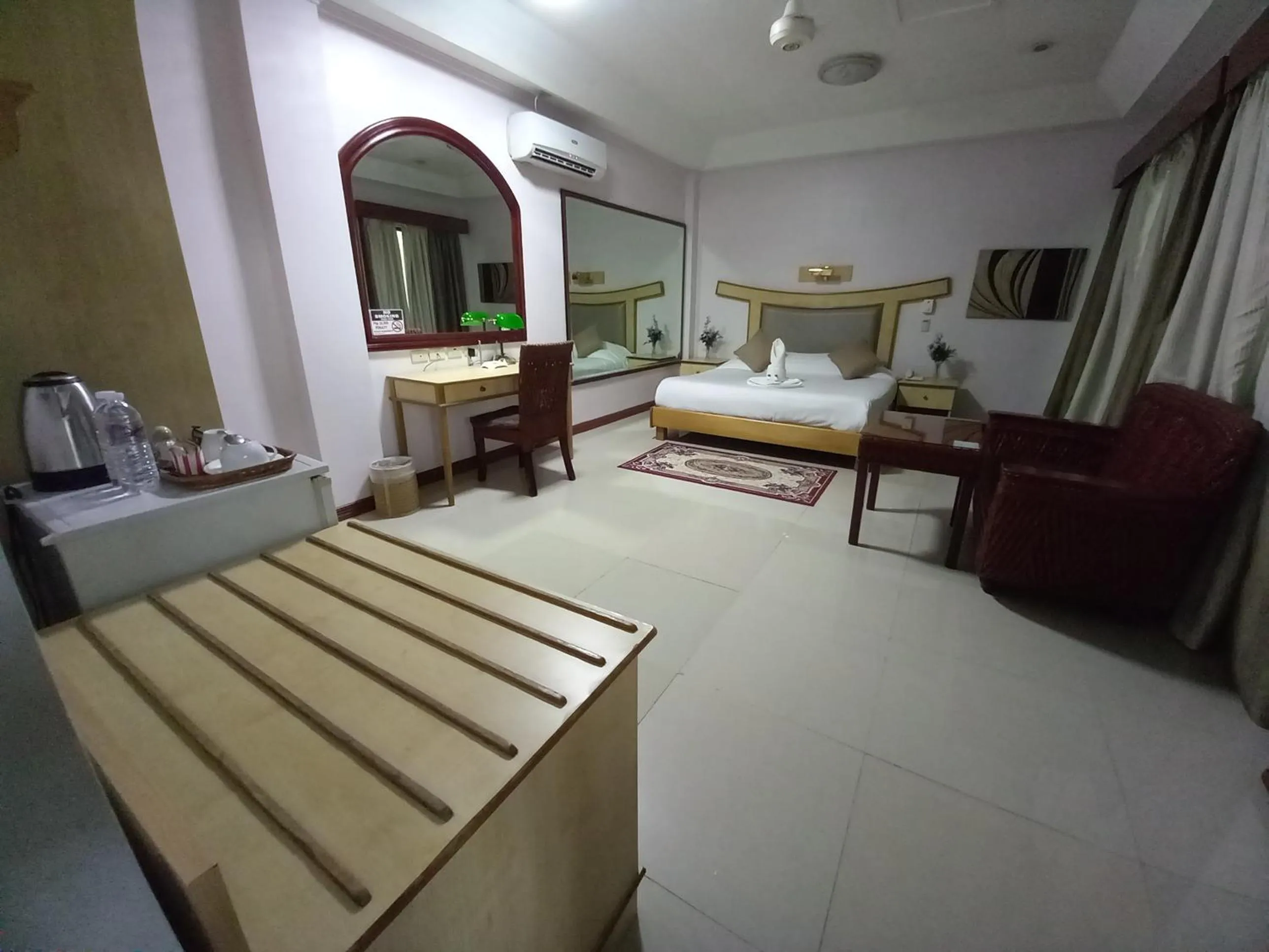 Living room, Bed in Wild Orchid Resort