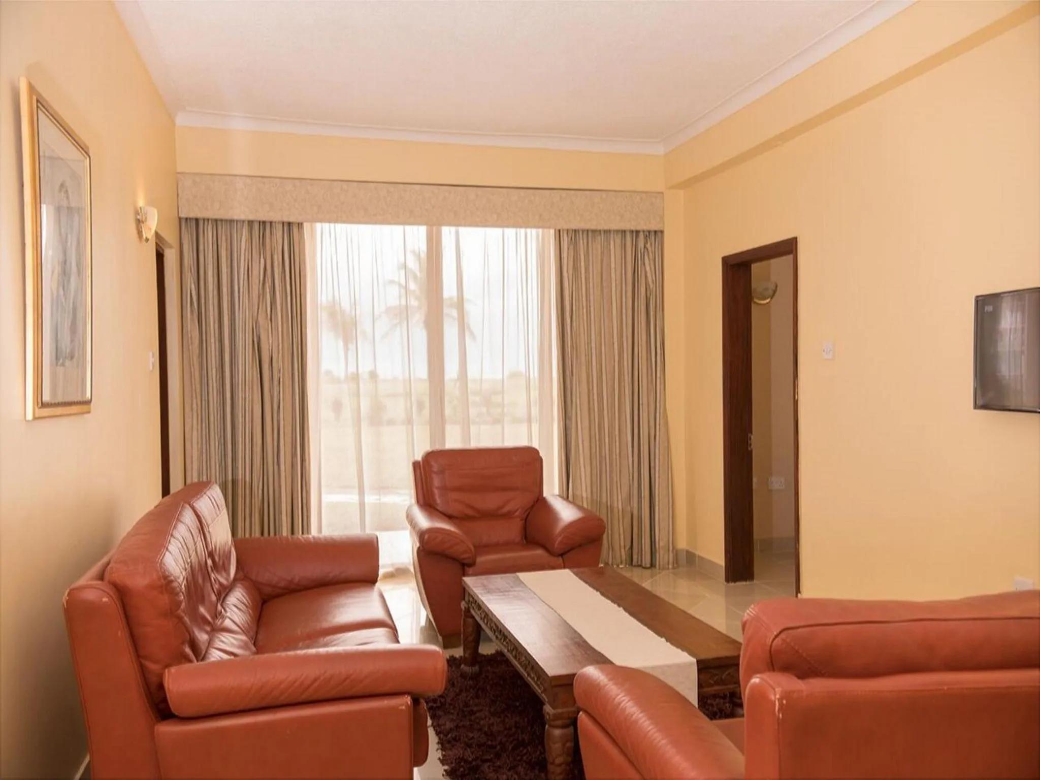 Living room, Seating Area in Golden Tulip Tanzania