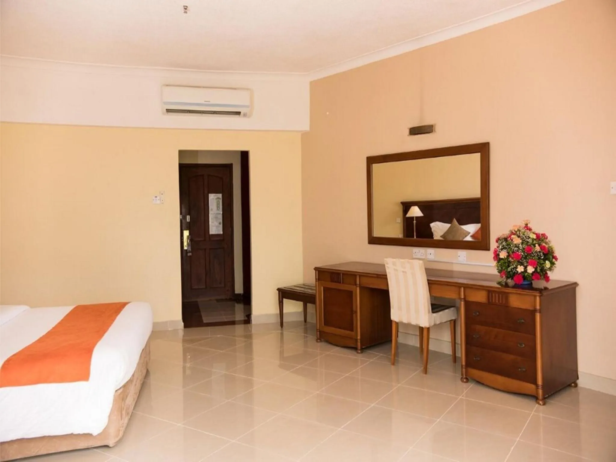 Bedroom, TV/Entertainment Center in Golden Tulip Tanzania