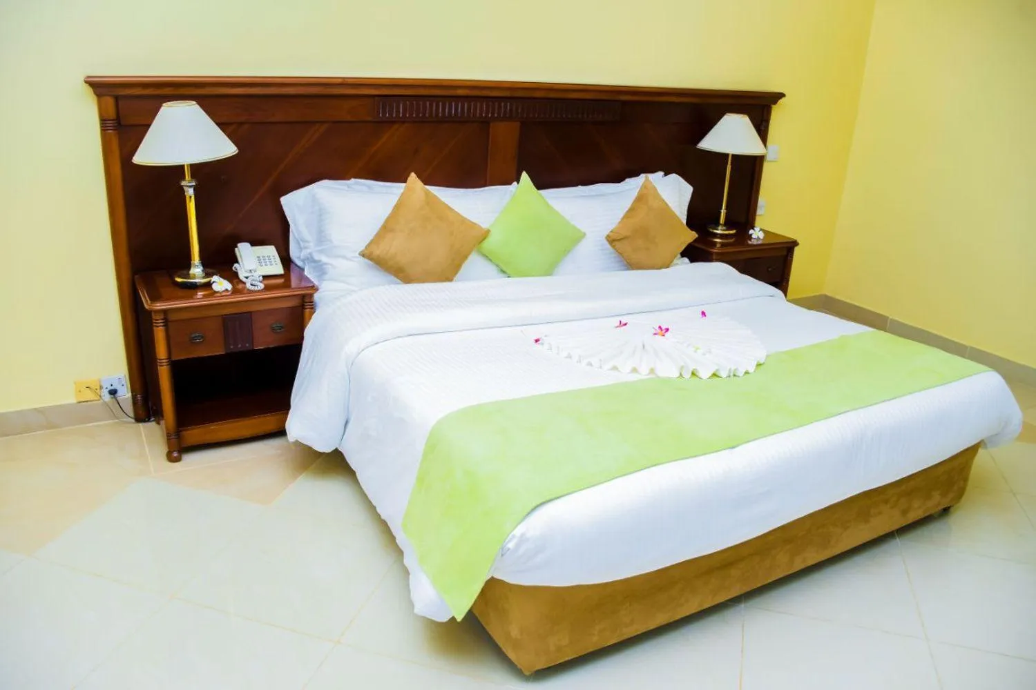 Bed in Golden Tulip Tanzania