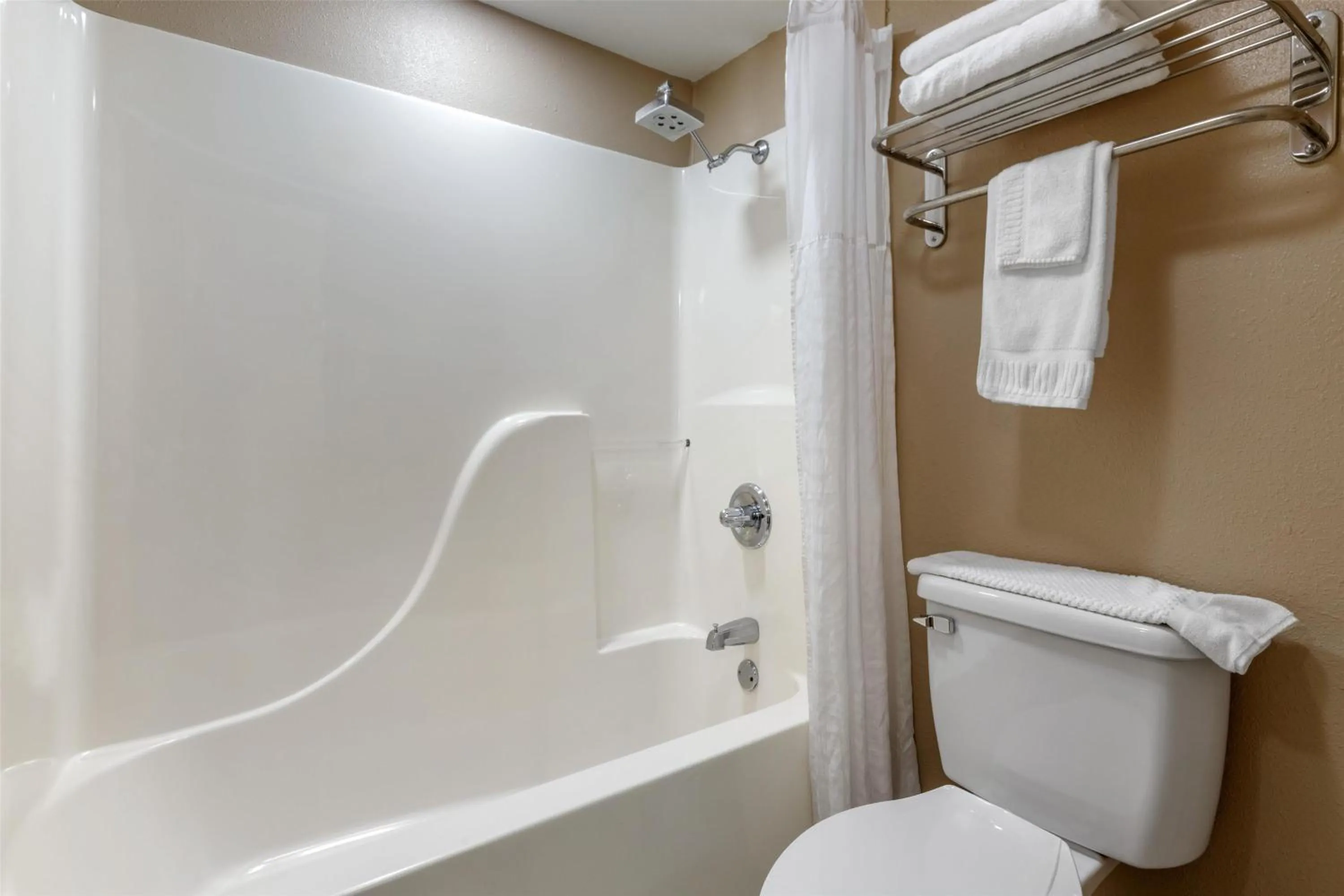 Bathroom in SureStay Plus Hotel by Best Western Poteau