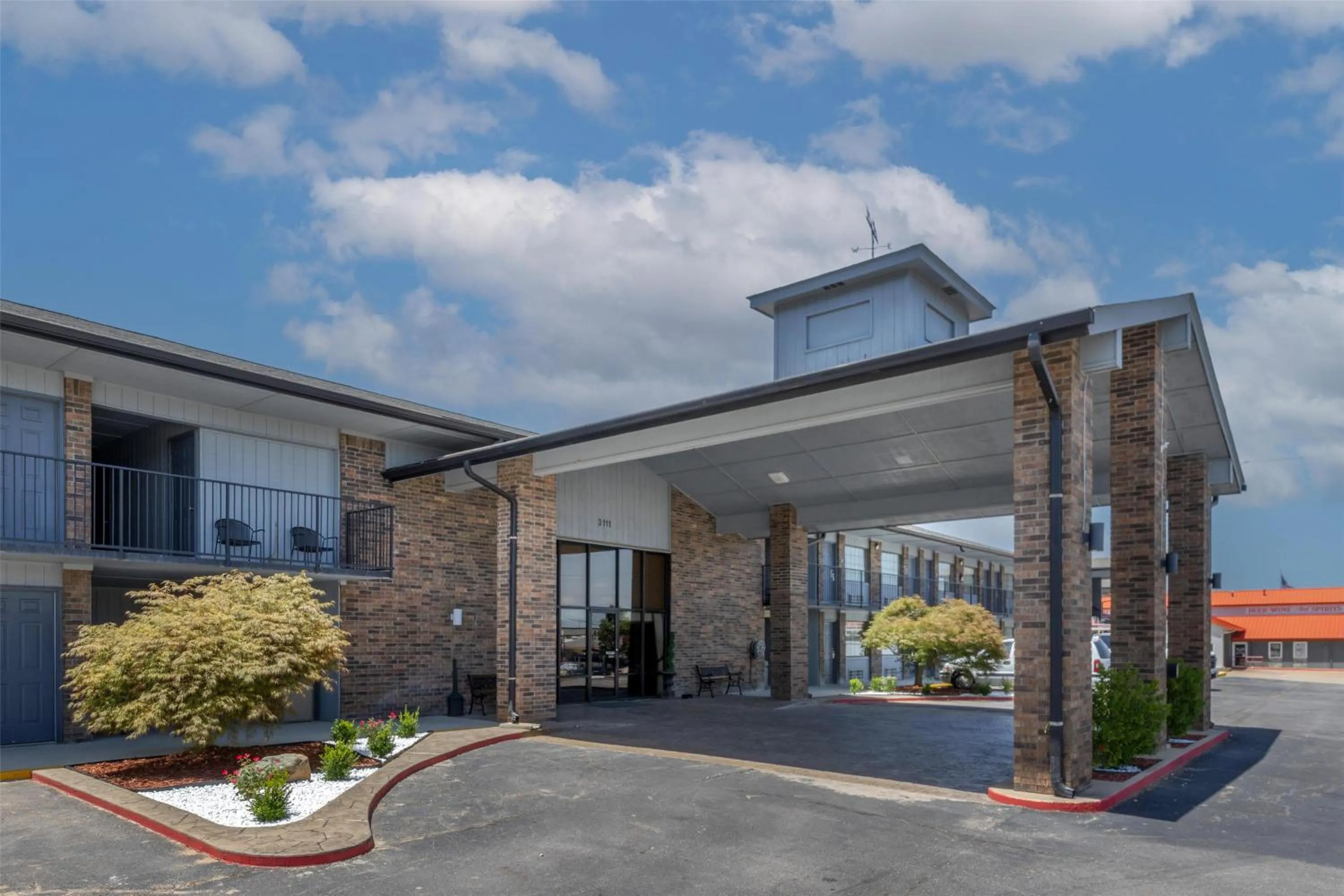 Property building in SureStay Plus Hotel by Best Western Poteau