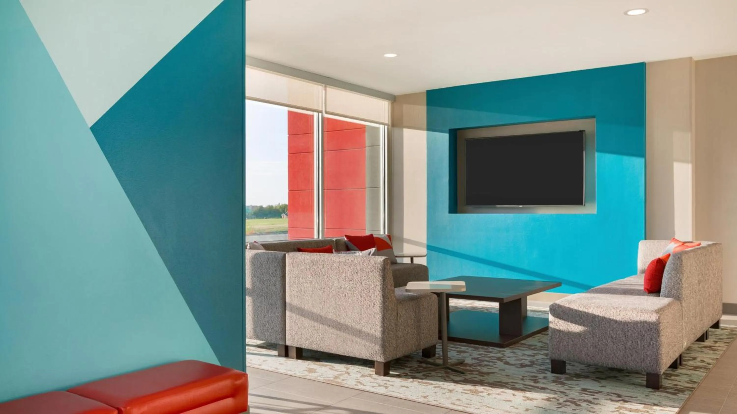 Communal lounge/ TV room in avid hotel - Ft Lauderdale Airport - Cruise by IHG
