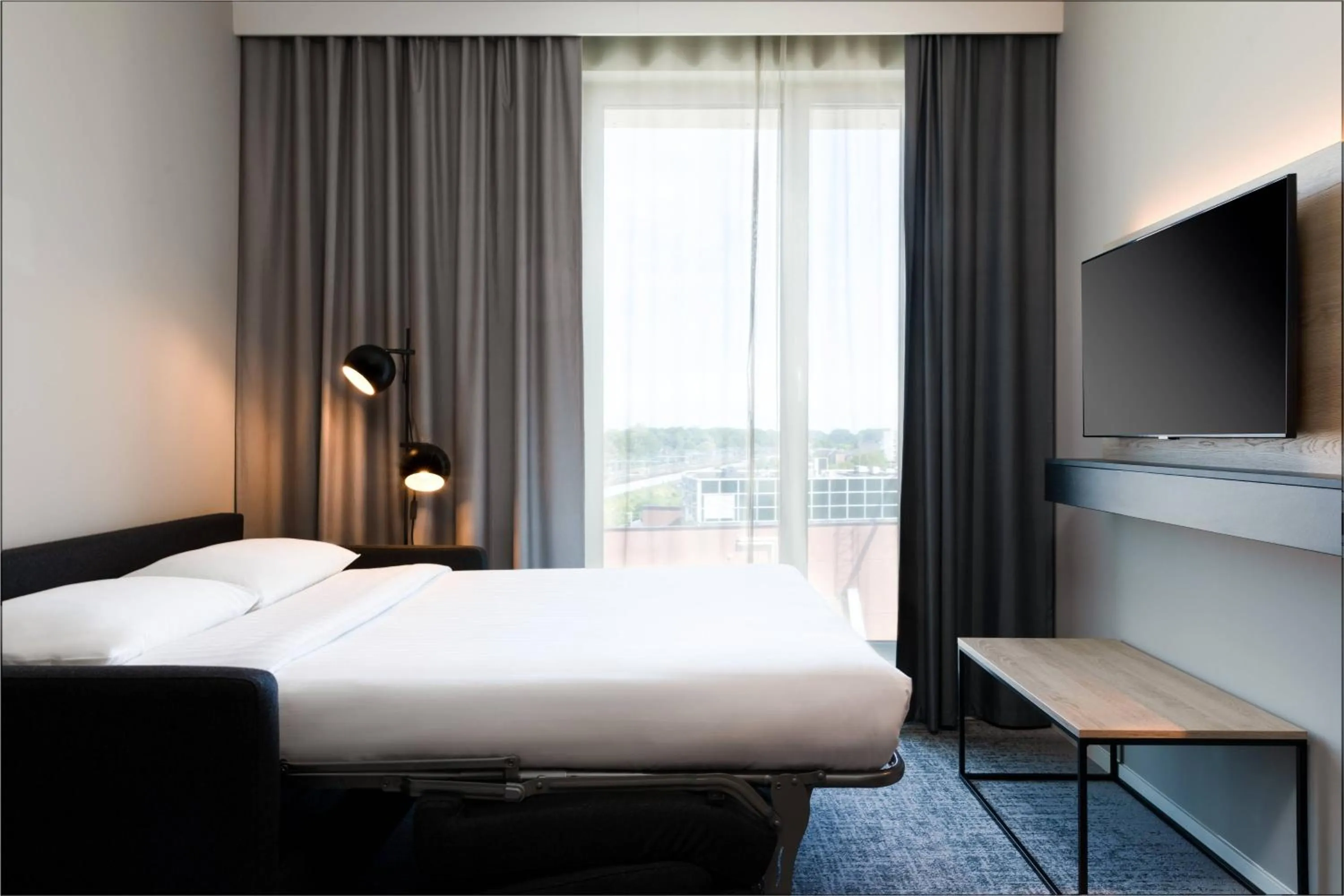 Photo of the whole room, Bed in Moxy Utrecht