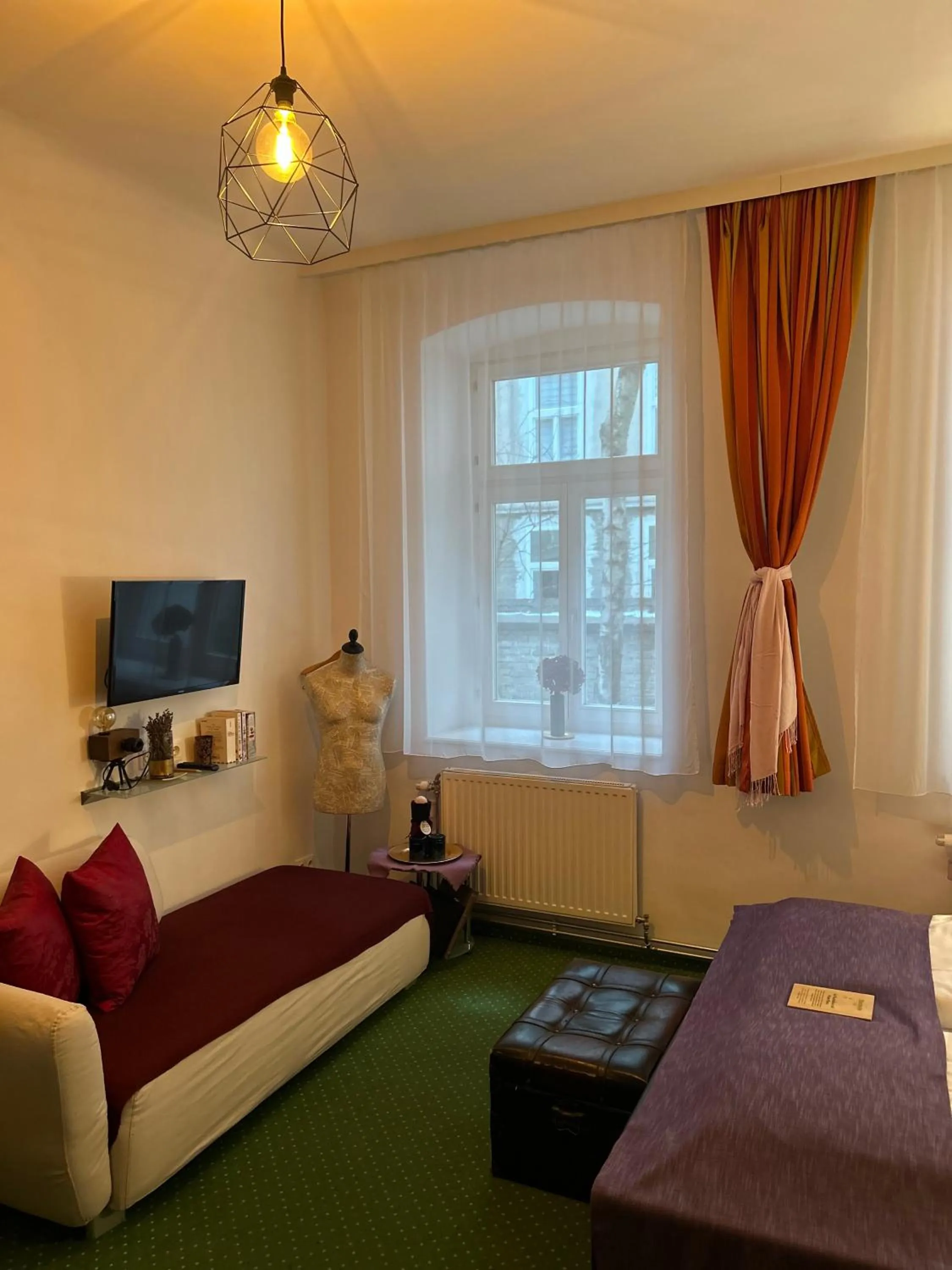 Photo of the whole room, Bed in Pension Stadthalle