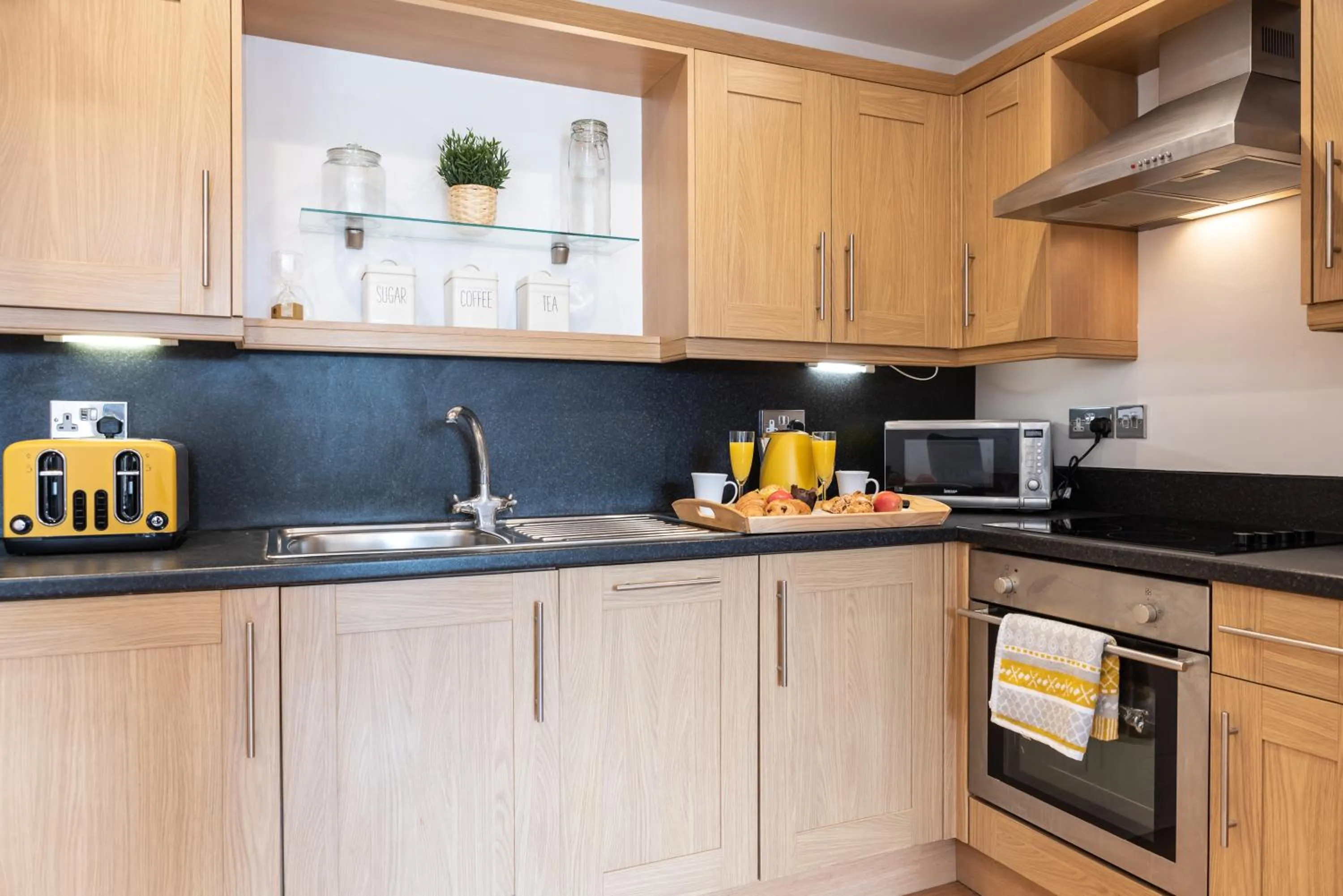 Kitchen or kitchenette in The Old Library - Modern Apartment near the Train Station and Racecourse