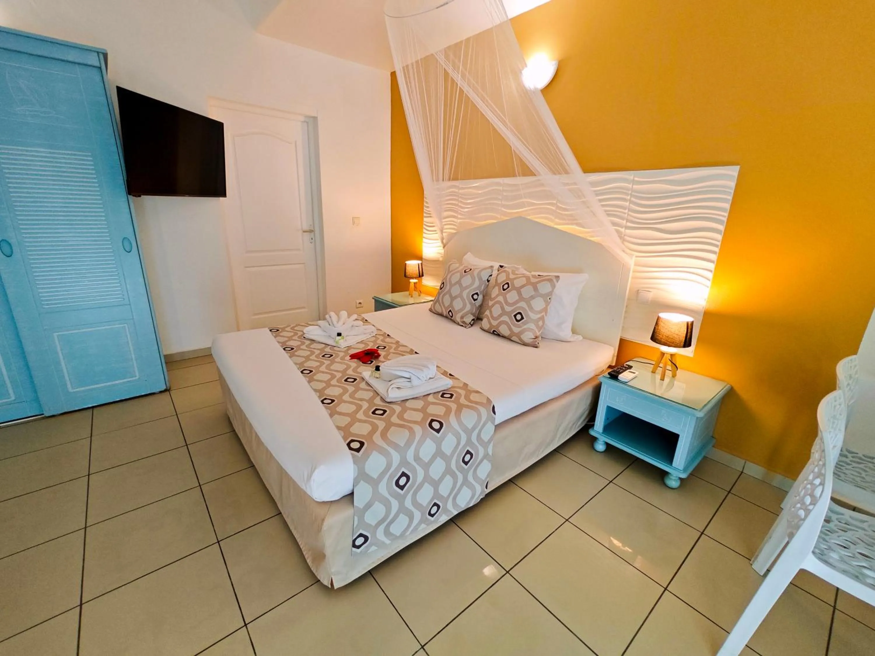 Bed in Tropicana Suites