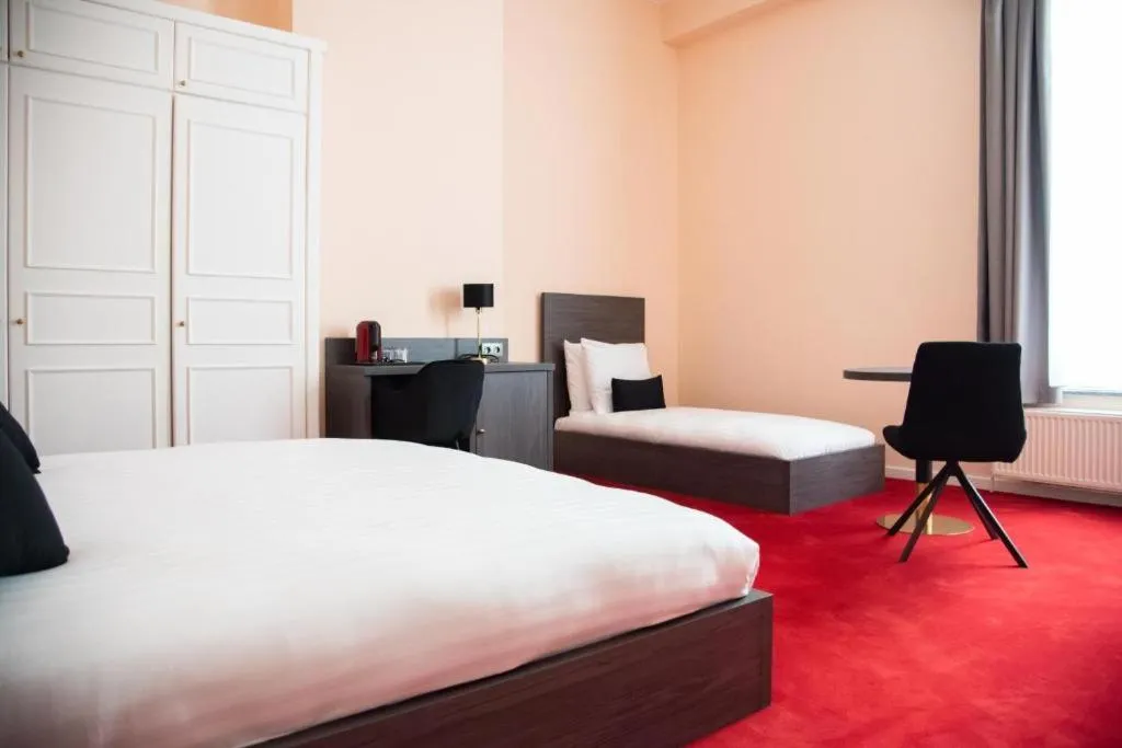 Bed in La Bourse Hotel