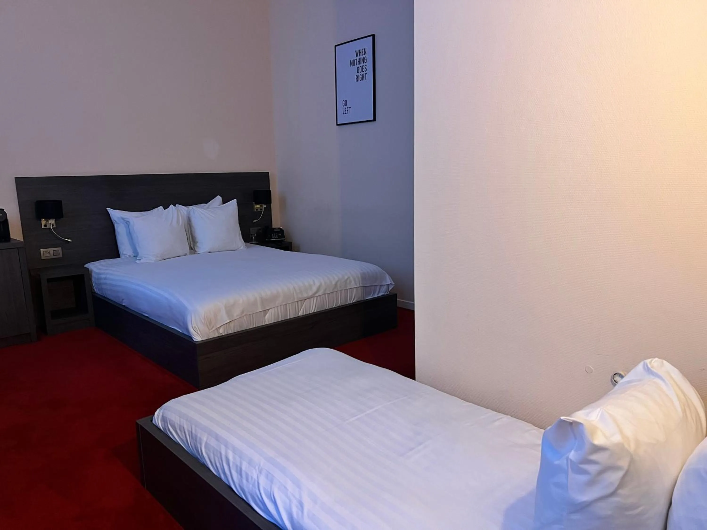 Bed in La Bourse Hotel