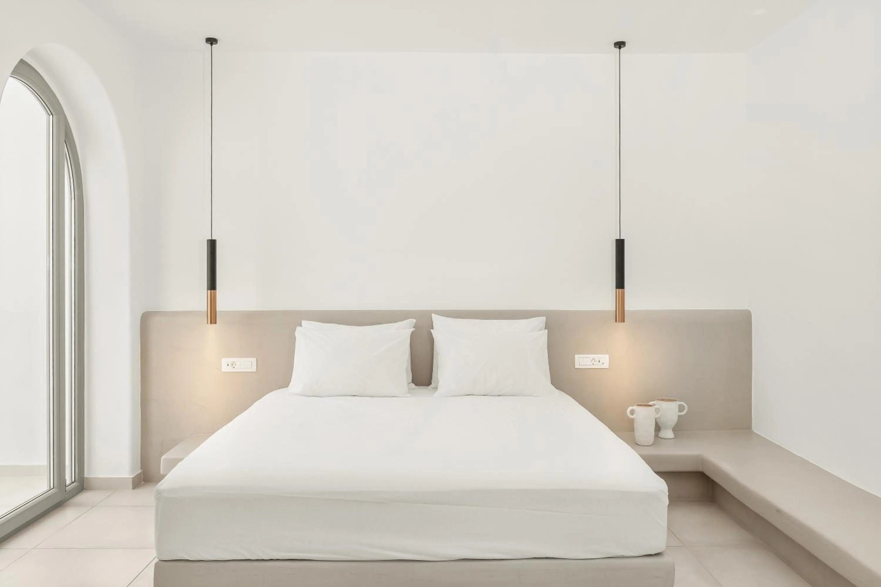 Bed in Oyster Luxury Suites