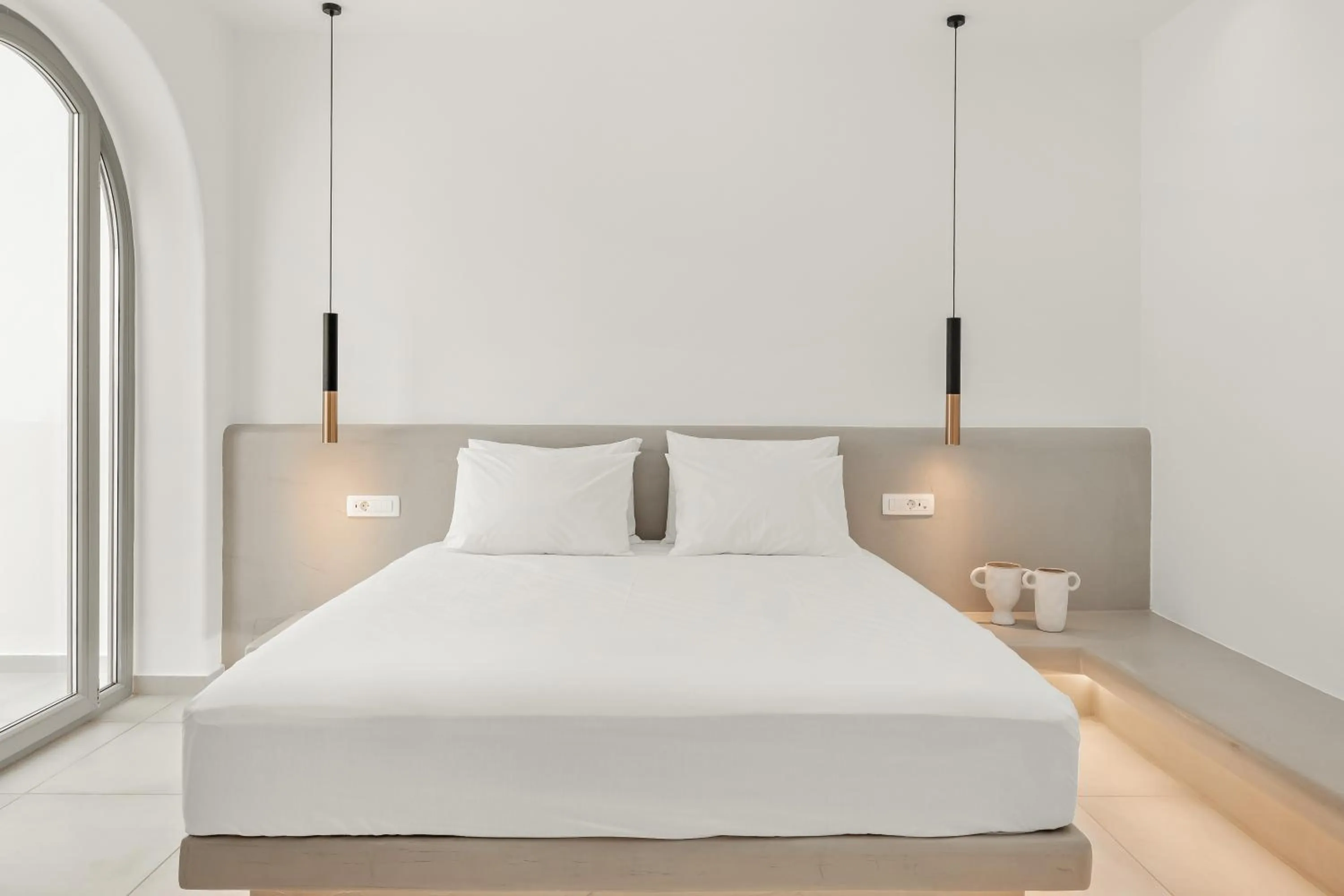 Bed in Oyster Luxury Suites