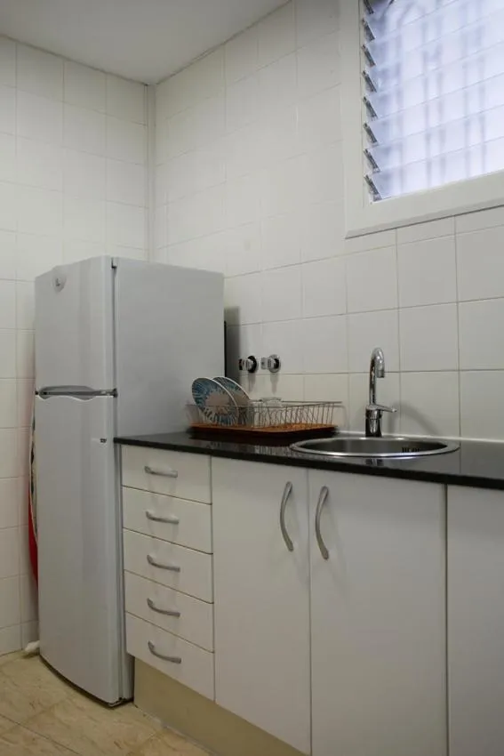 Kitchen or kitchenette in Colom Apartments