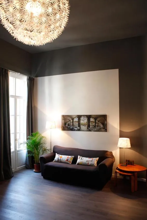 Living room, Bed in Colom Apartments