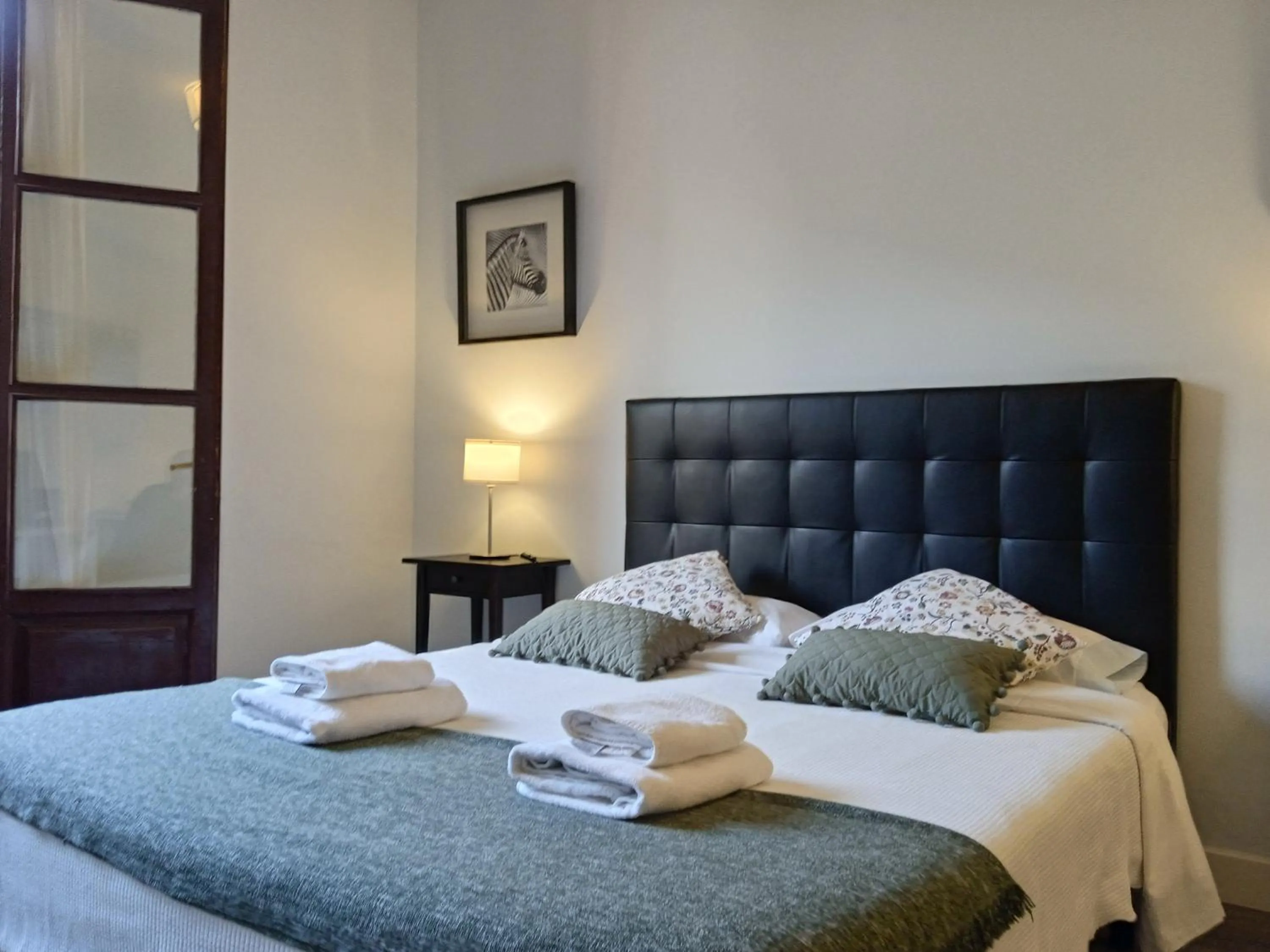 Dining area, Bed in Colom Apartments