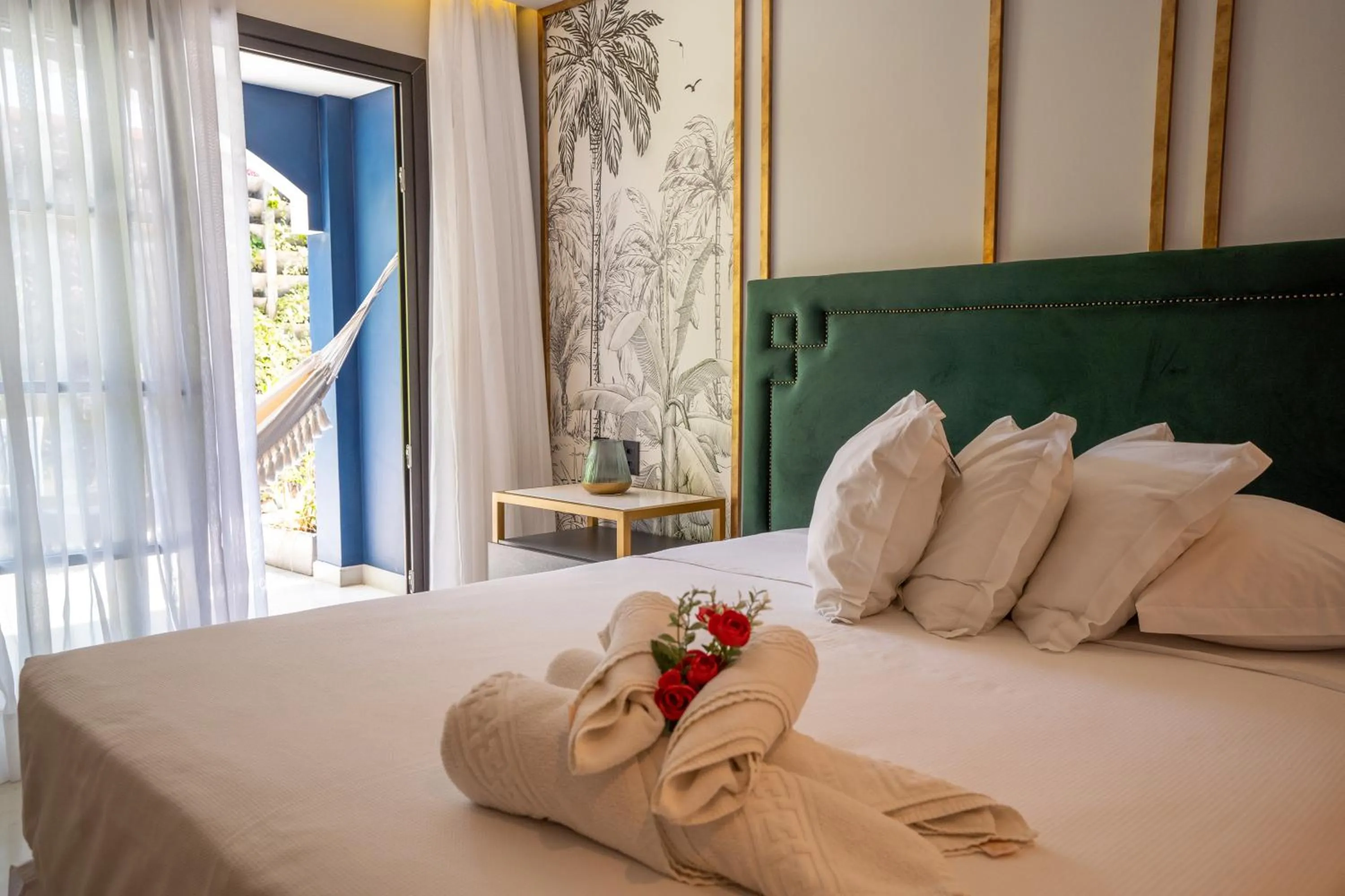 Bed in Exótica Boutique Hotel