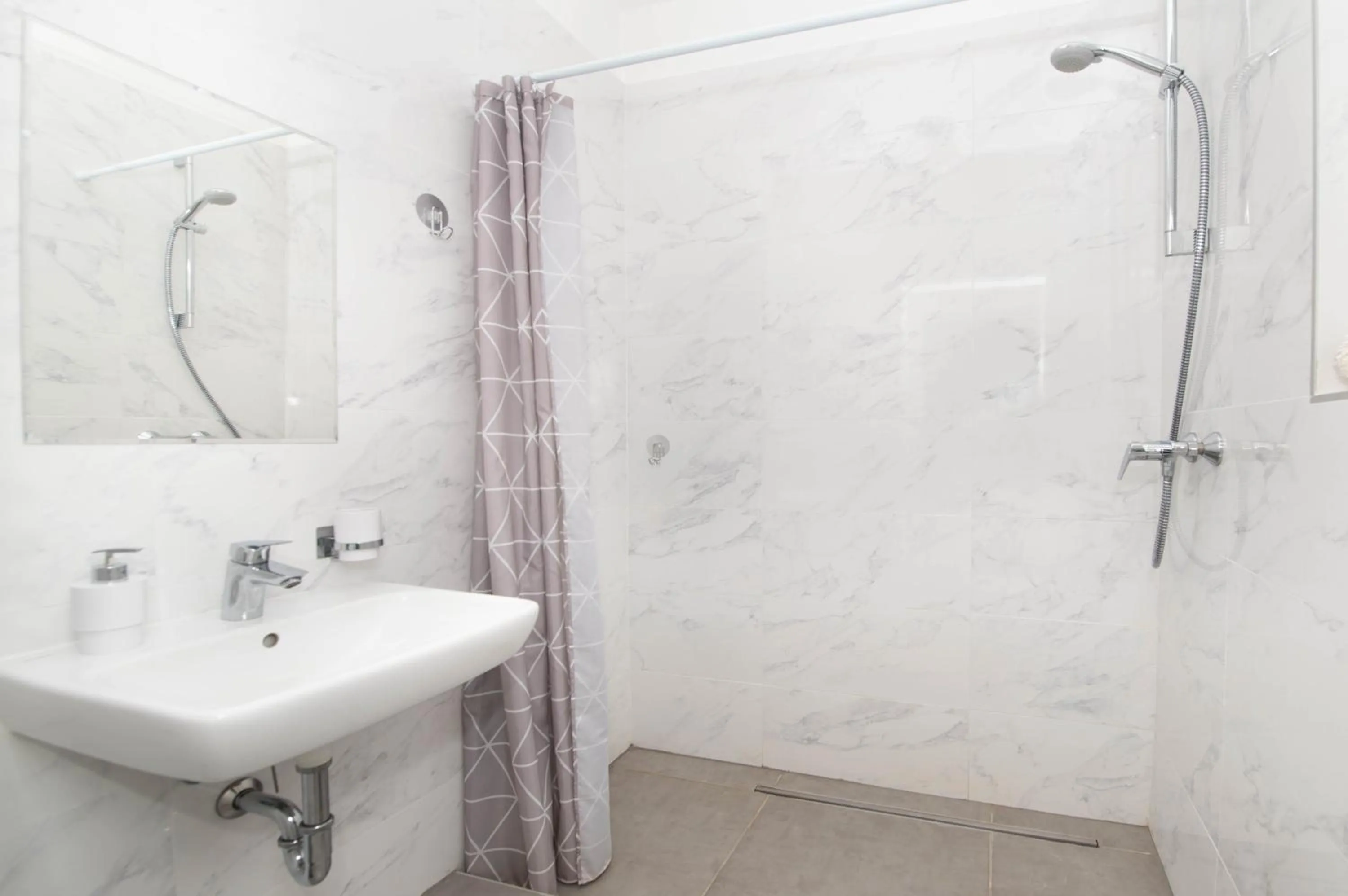 Shower in Elisabeth Downtown Apartments by FirstHost