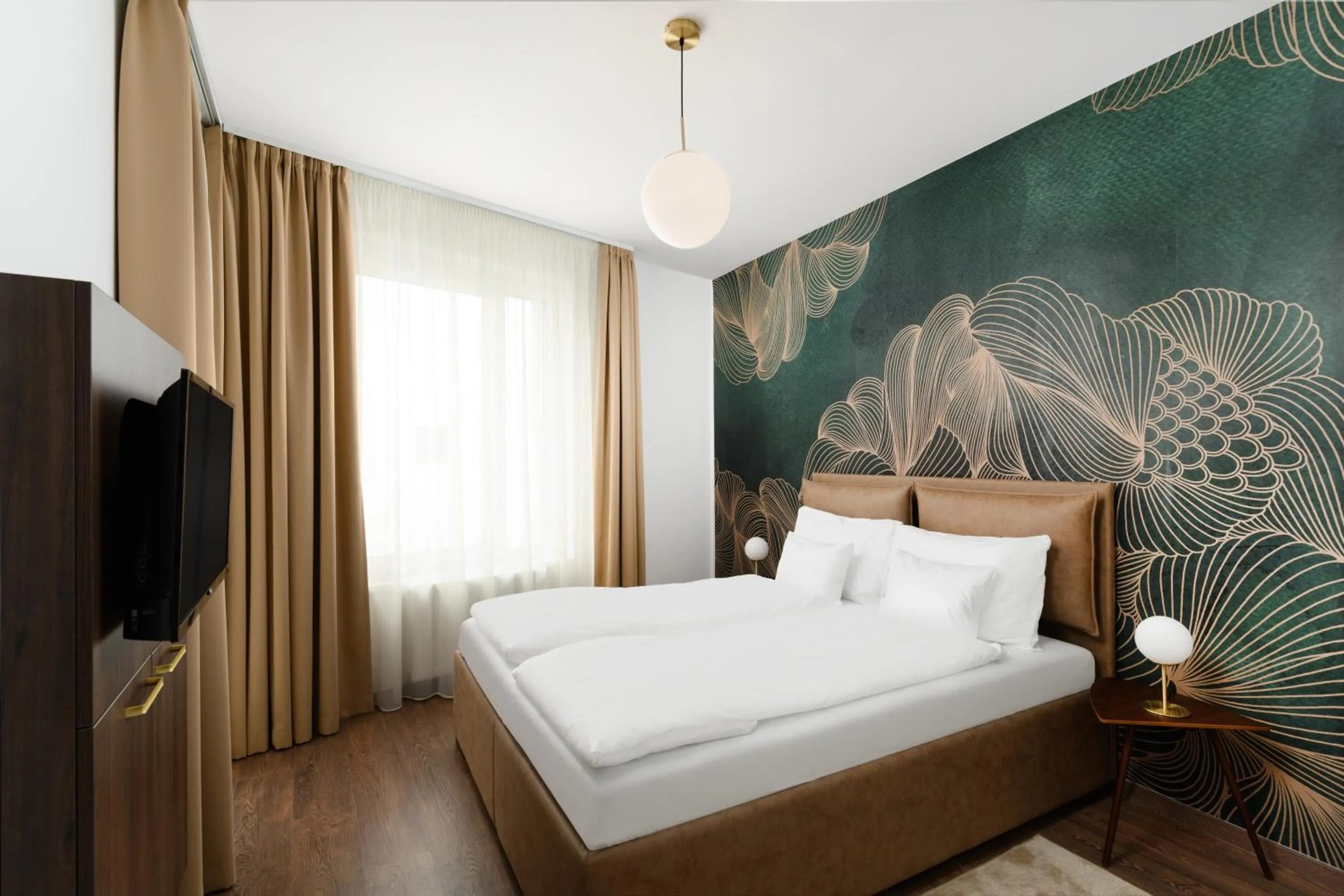 Bed in Elisabeth Downtown Apartments by FirstHost