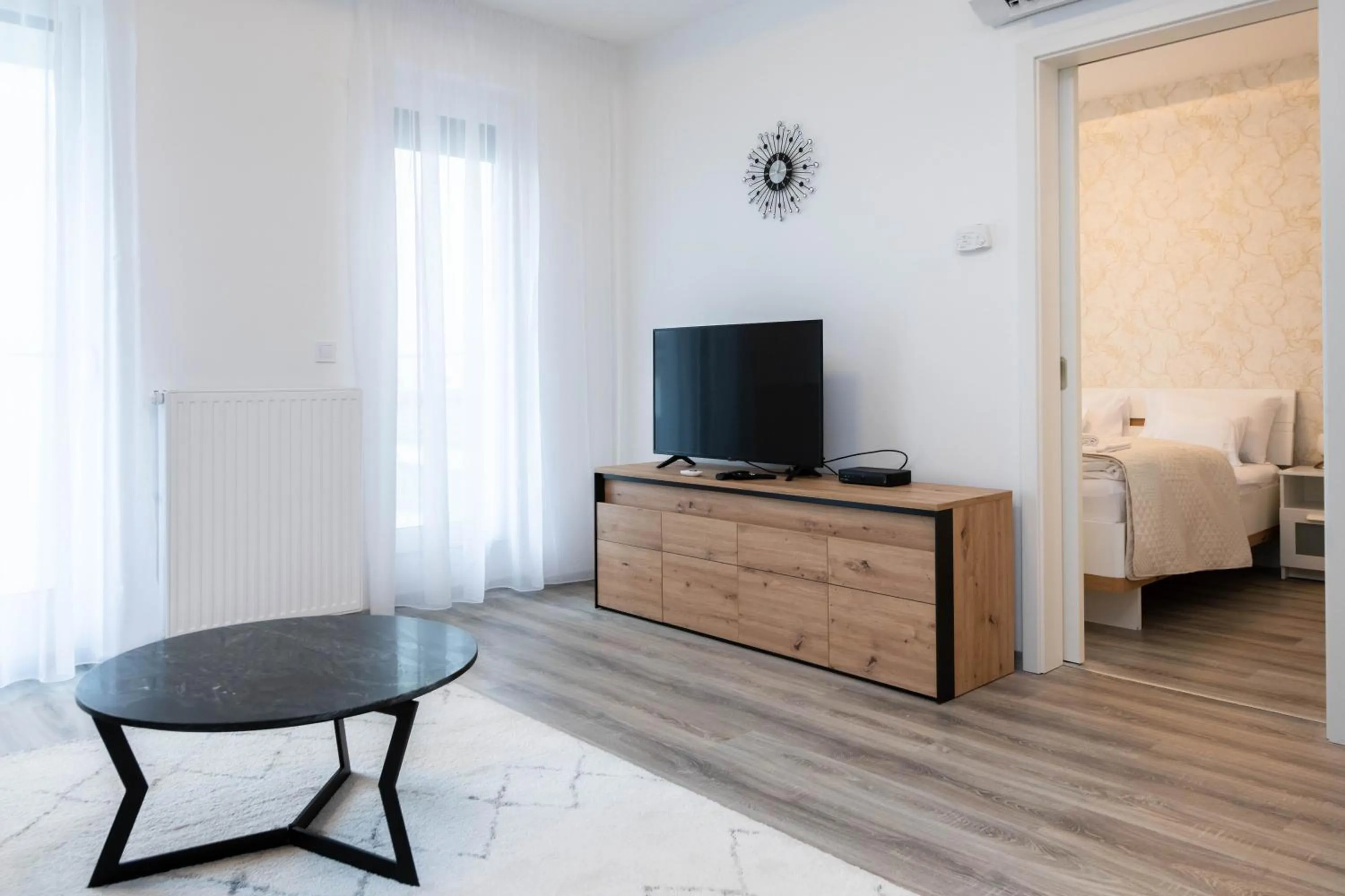 Communal lounge/ TV room, Bed in Elisabeth Downtown Apartments by FirstHost