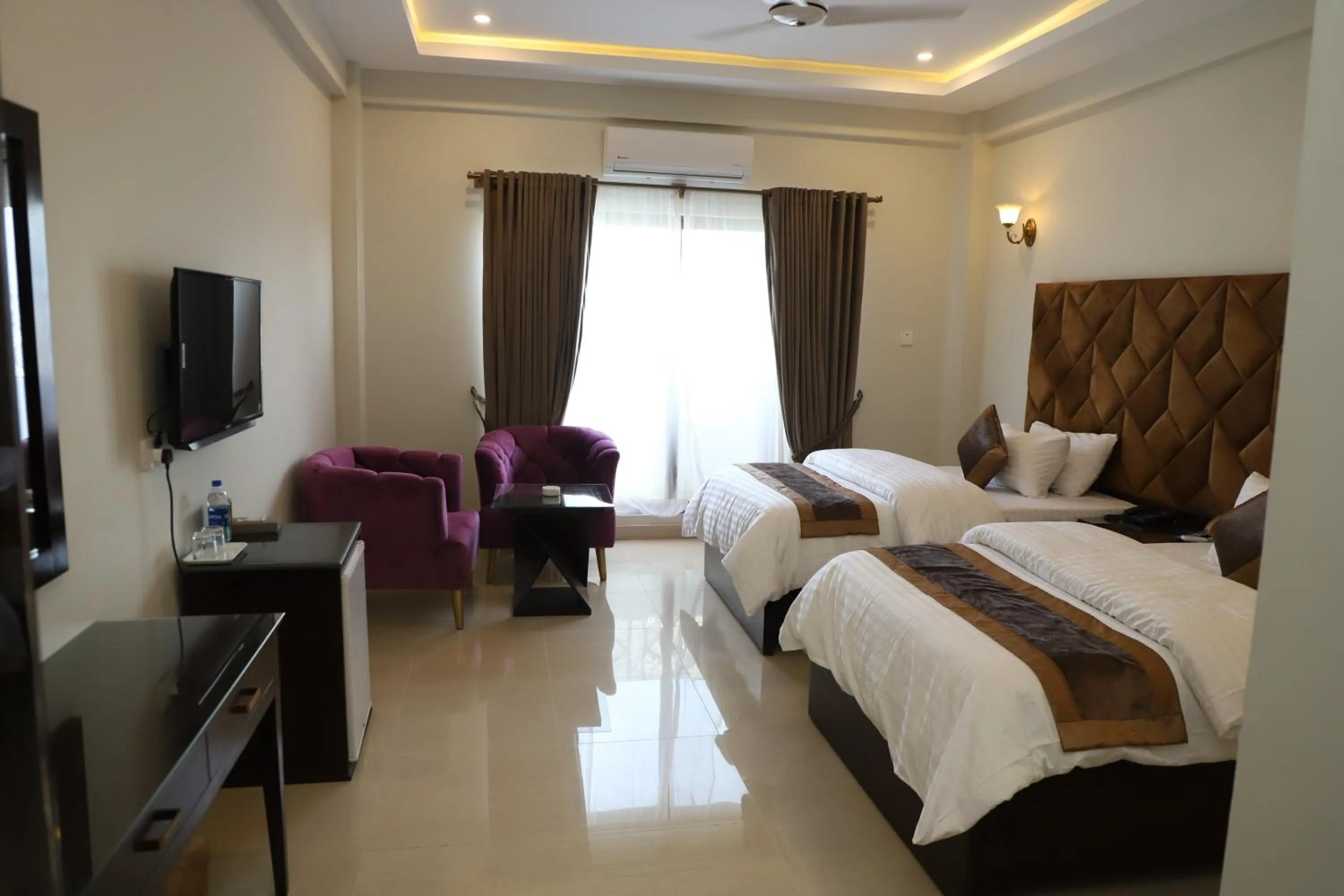 Photo of the whole room, Bed in Swat Palace Hotel By Northin