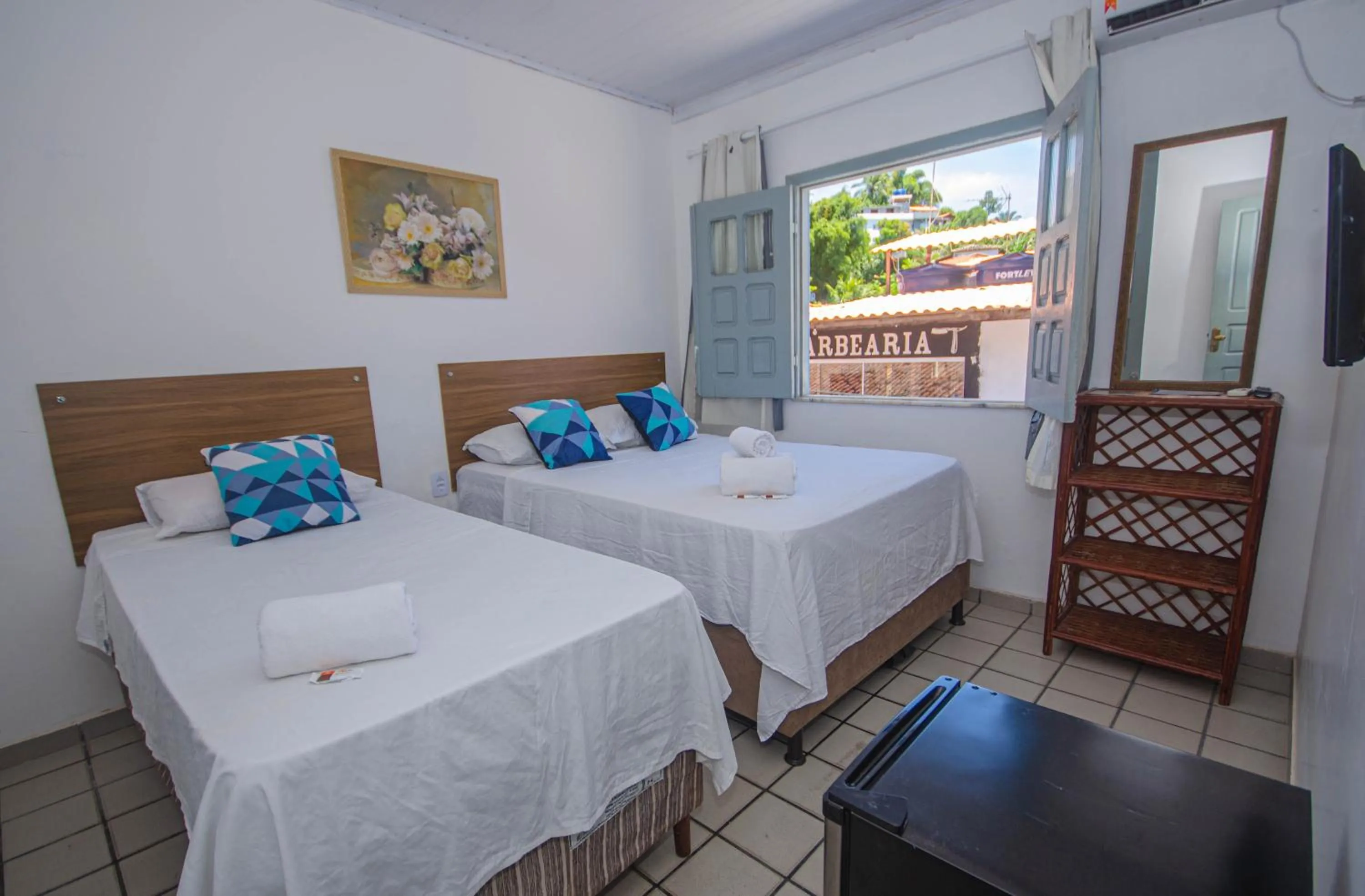 Bed in Pousada Morro Tropical