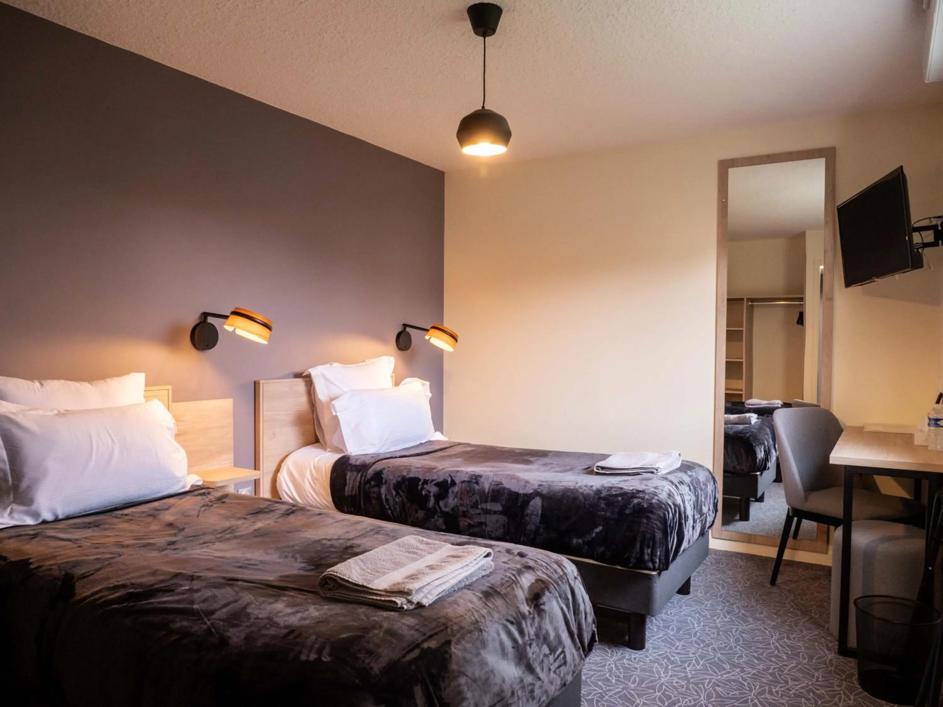 Bed in Logis hôtels Le Saint Pierre