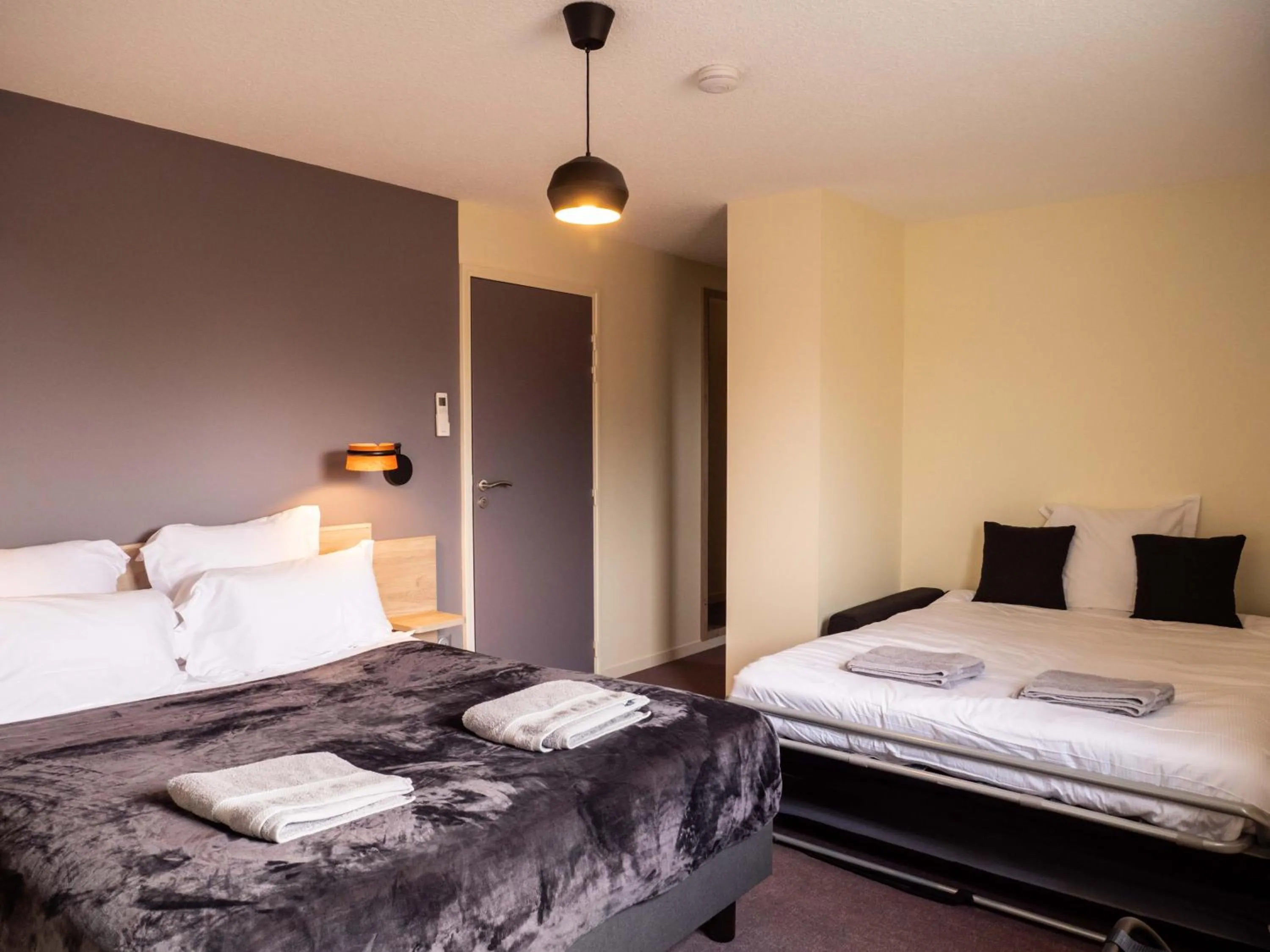 Bed in Logis hôtels Le Saint Pierre