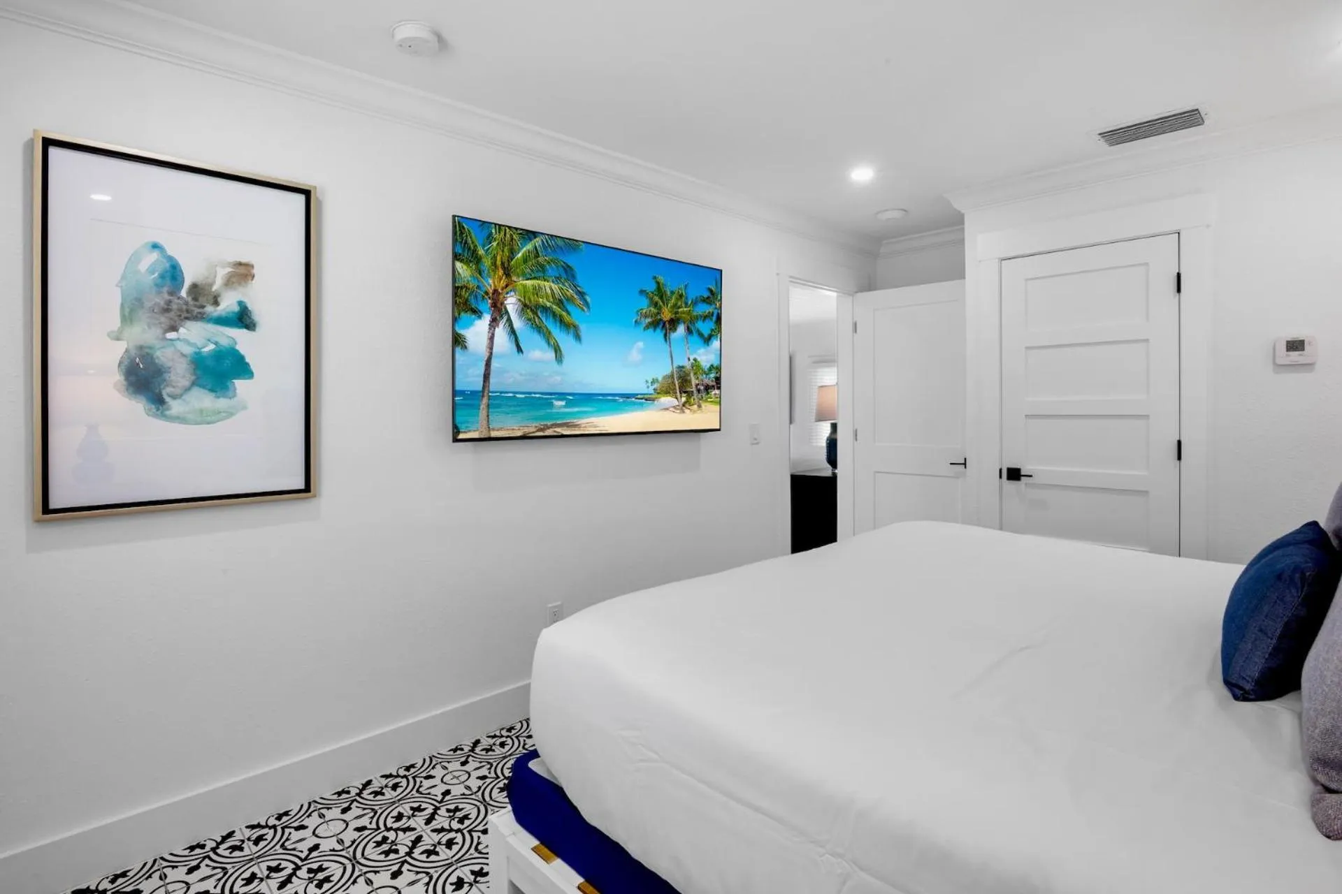 Bed in Pelican Post at Anna Maria Island Inn