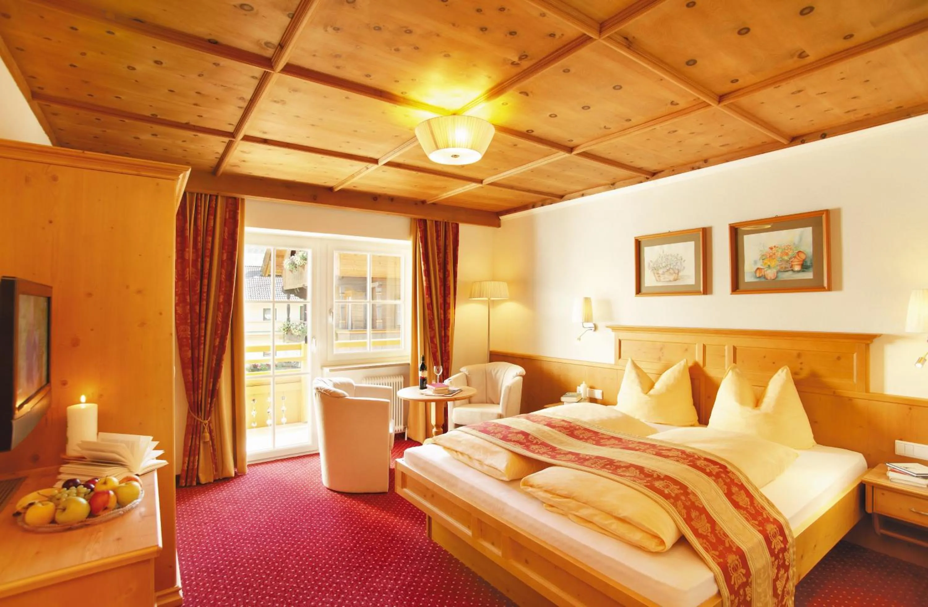 Bed in Alpenherz Hotel Garni