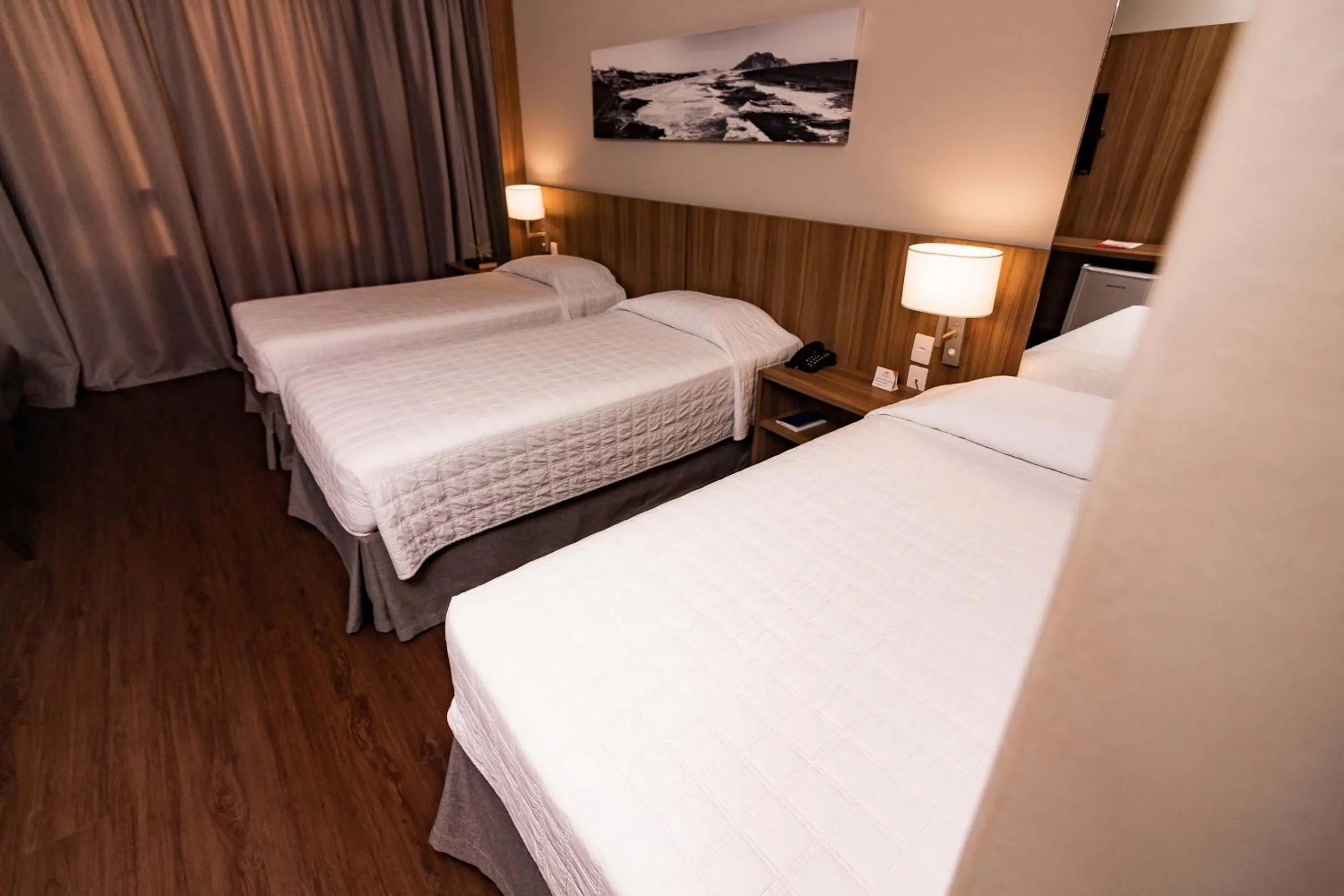 Bed in Kennedy Executive Hotel