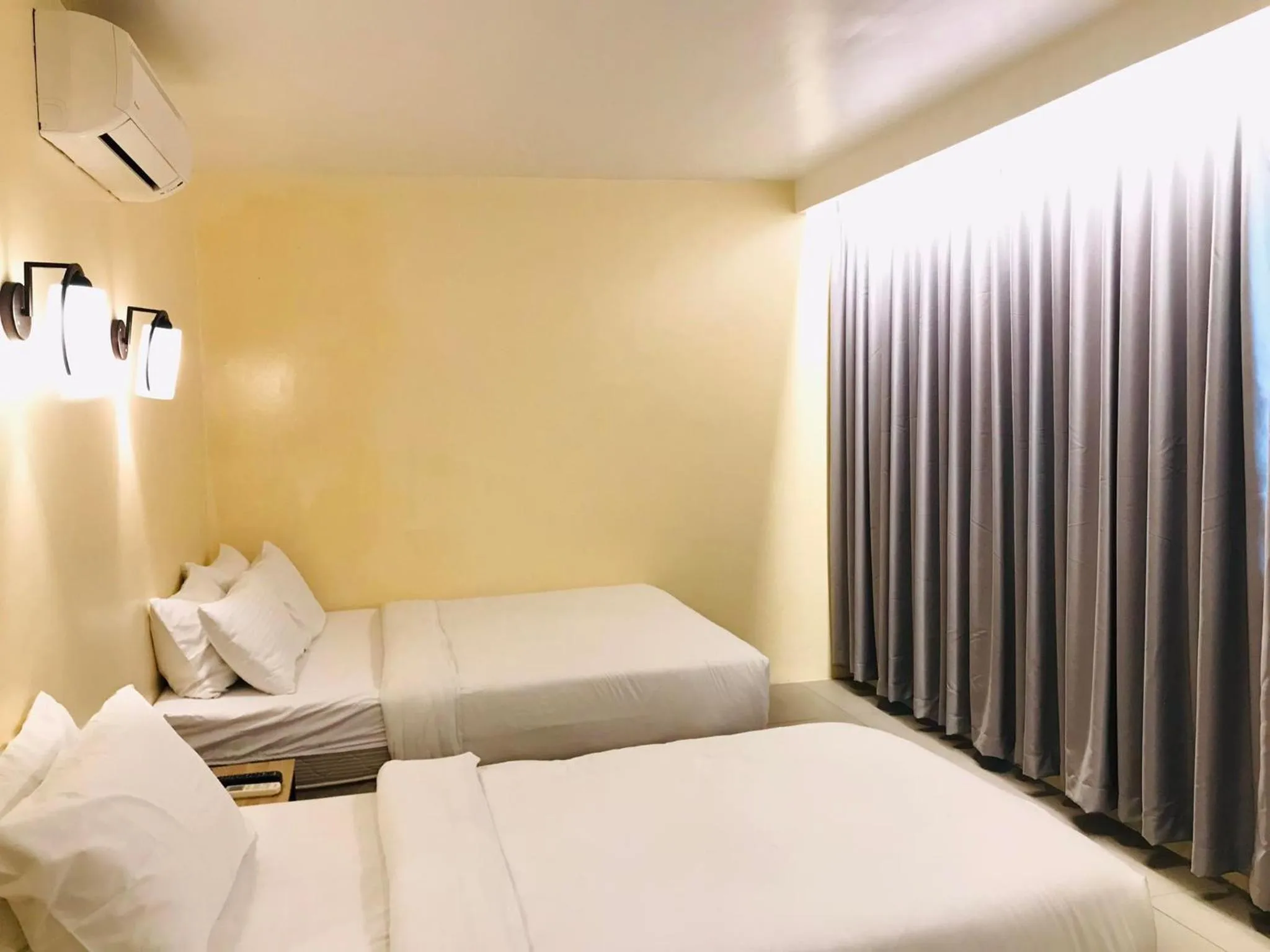 Bed in Dosi Hotel PH