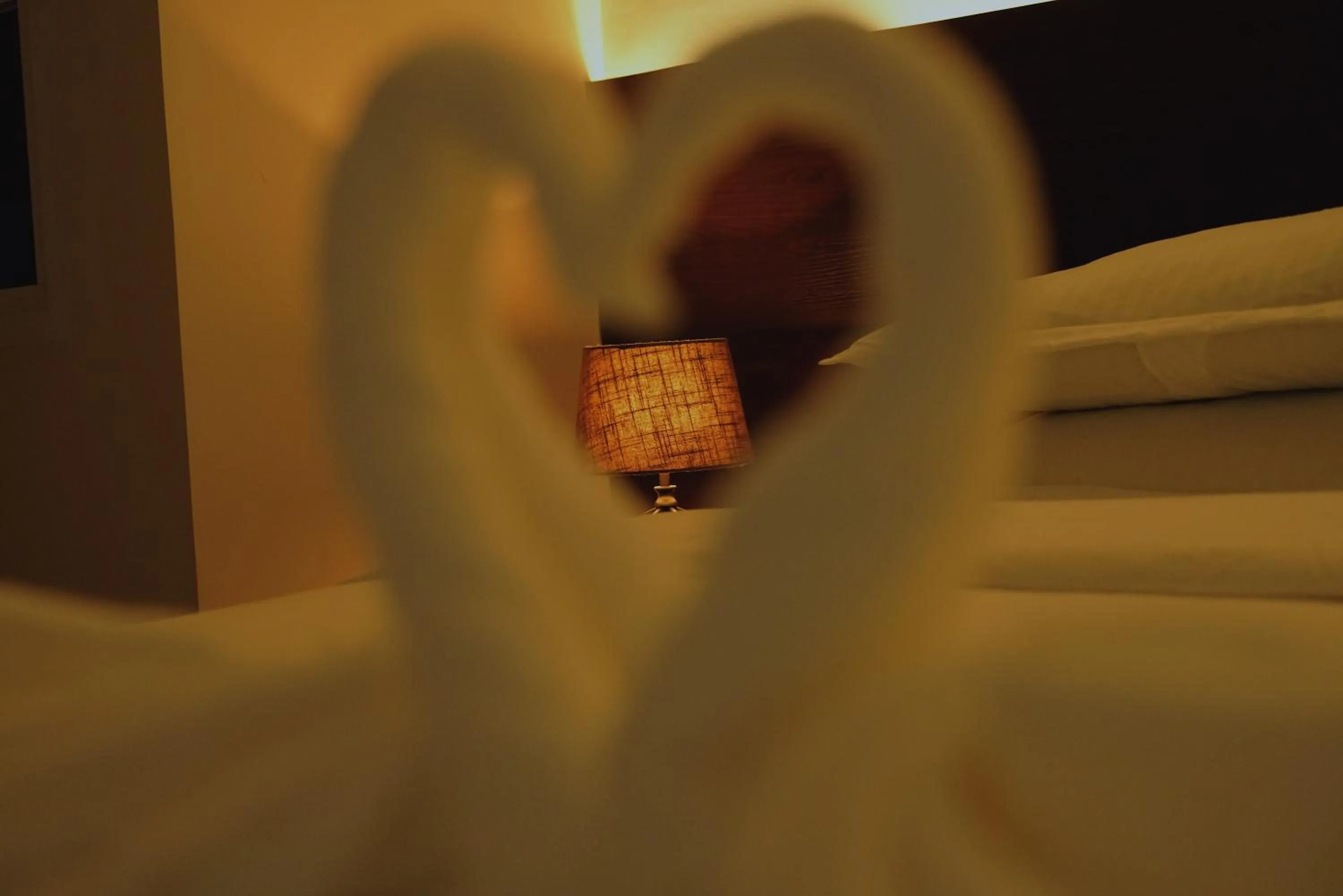 Bed in Violet Inn Hotel