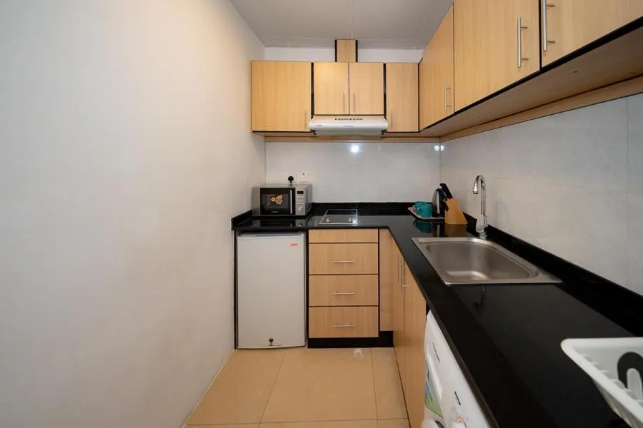 Kitchen or kitchenette in City Stay Grand Hotel Apartments - Al Barsha