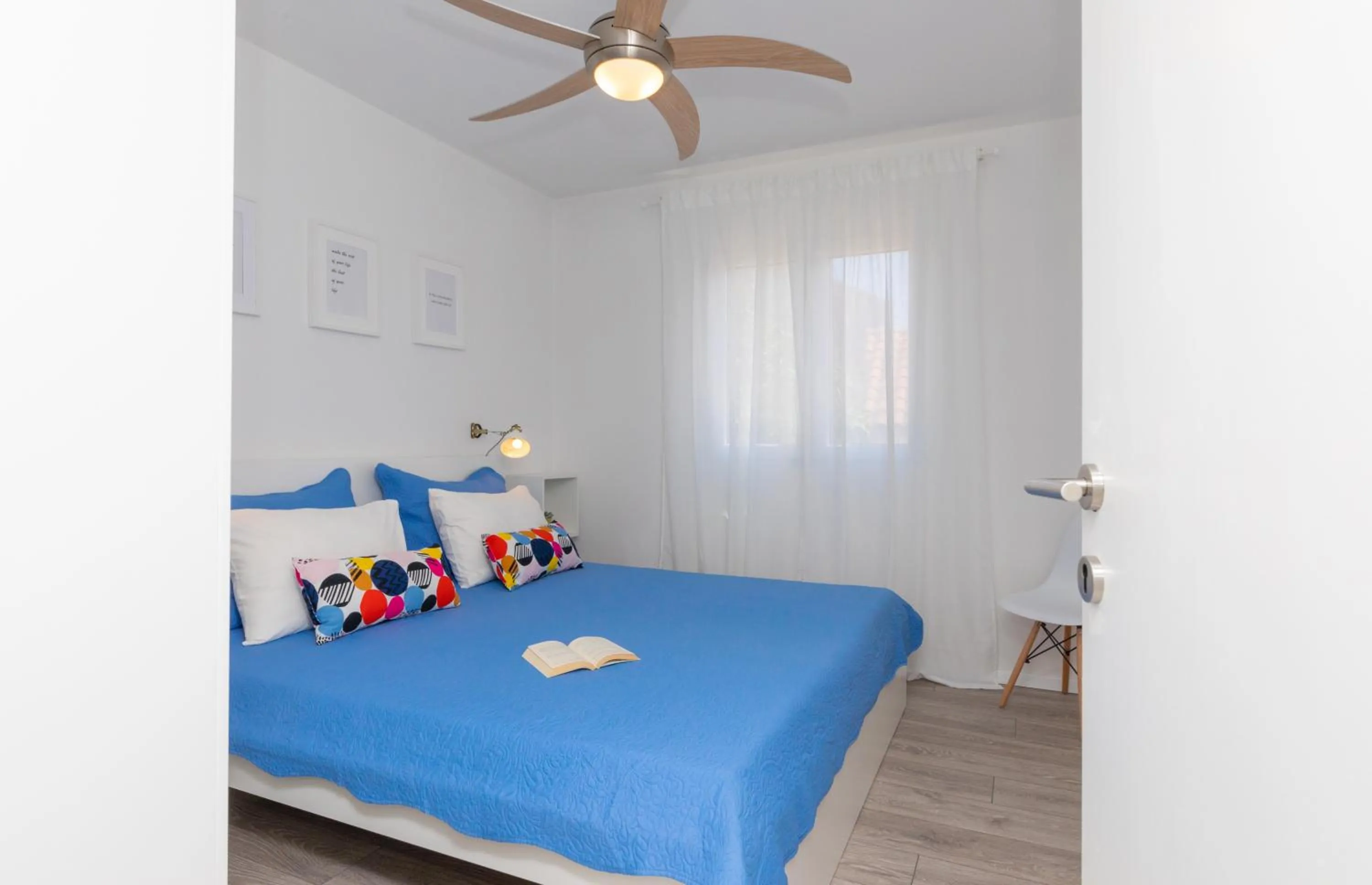 Bed in Two Flowers Luxury Apartment