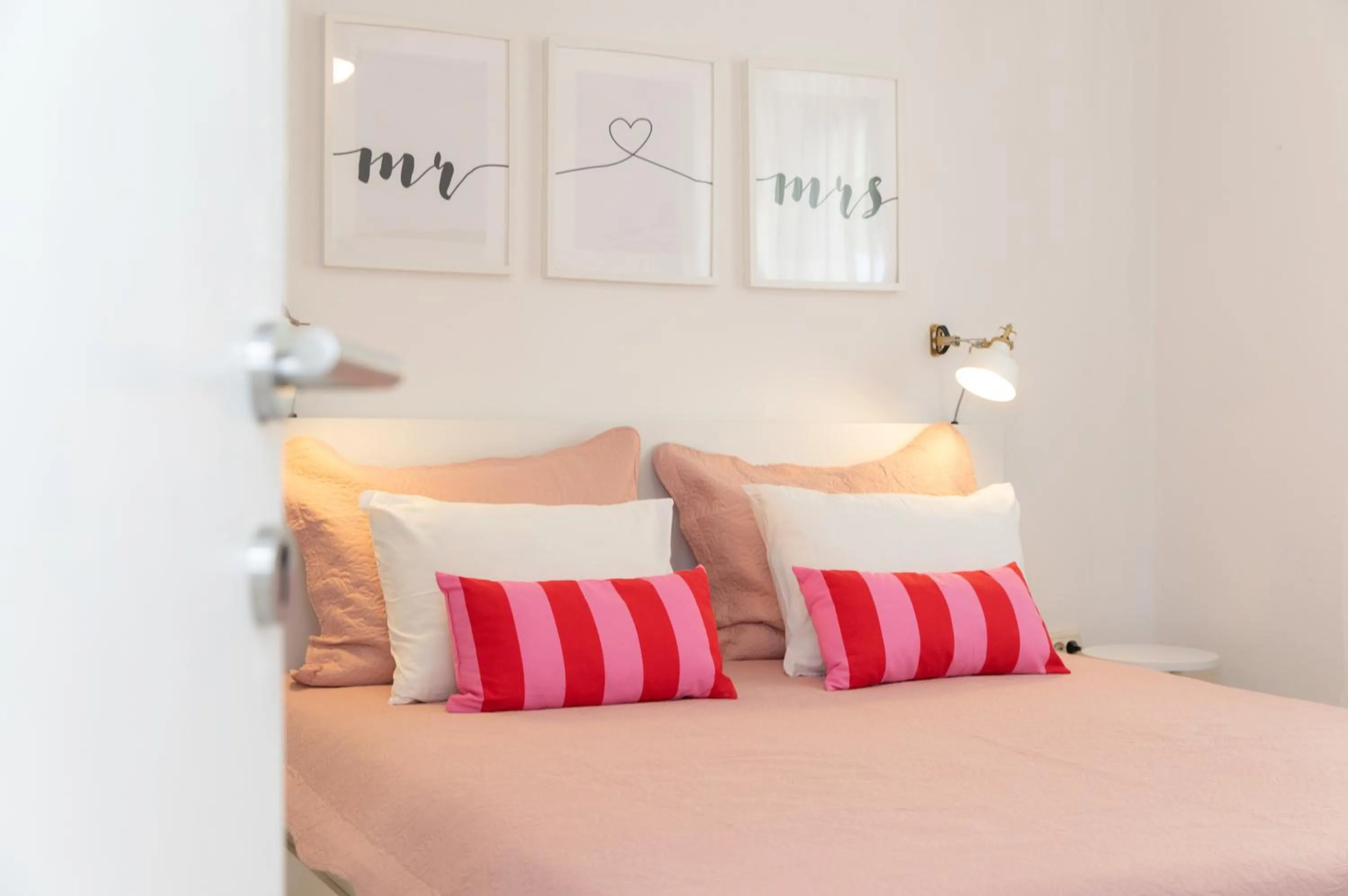 Bed in Two Flowers Luxury Apartment