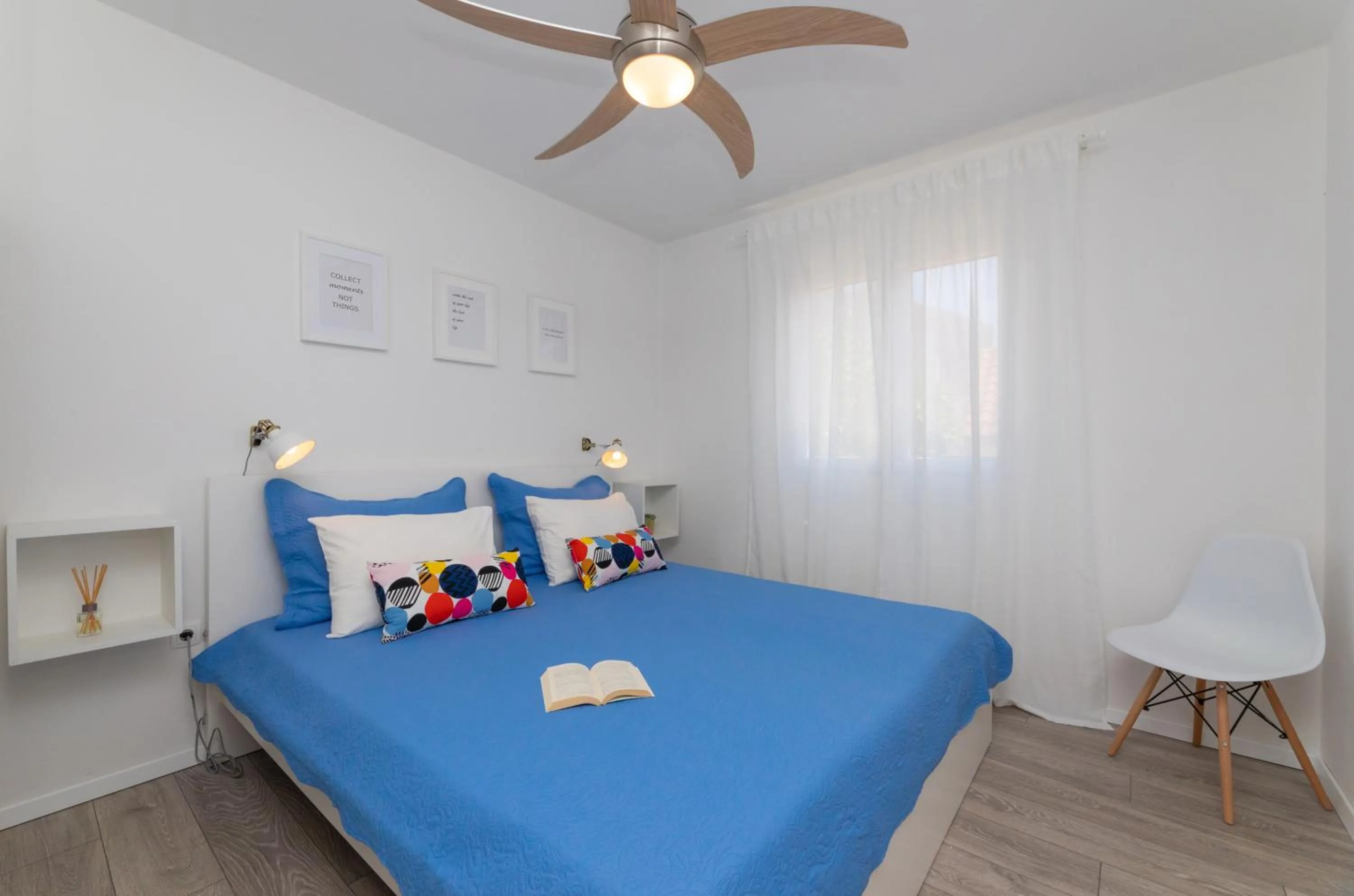 Bed in Two Flowers Luxury Apartment