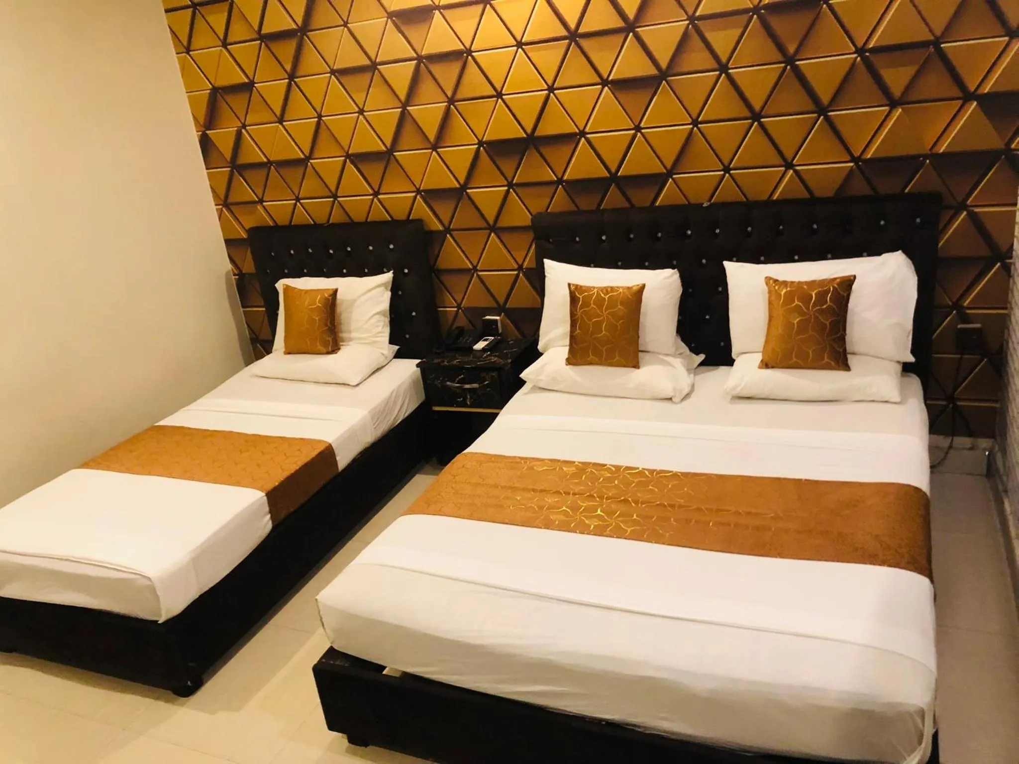 Bed in Hotel Tulip Inn