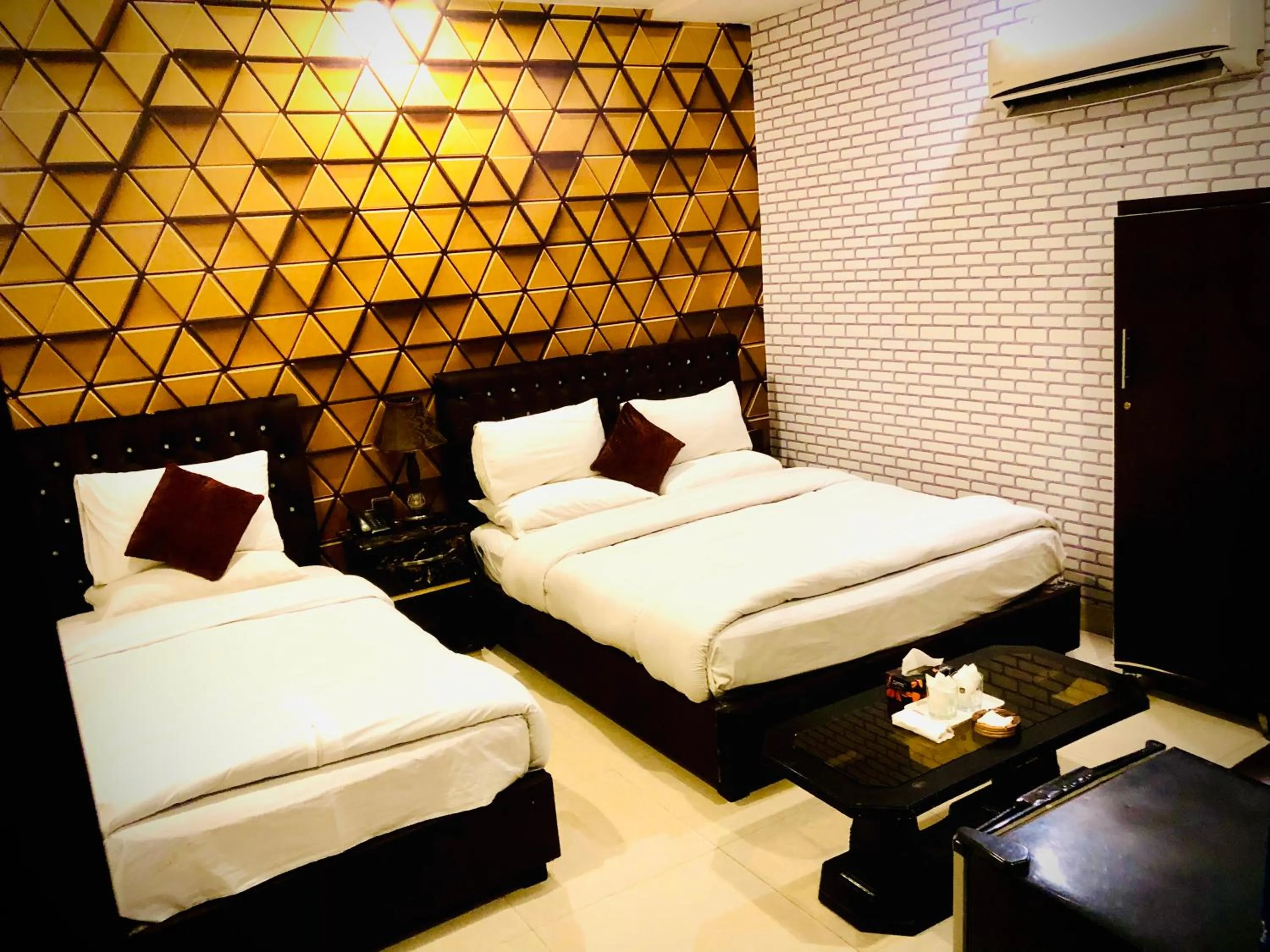 Bed in Hotel Tulip Inn