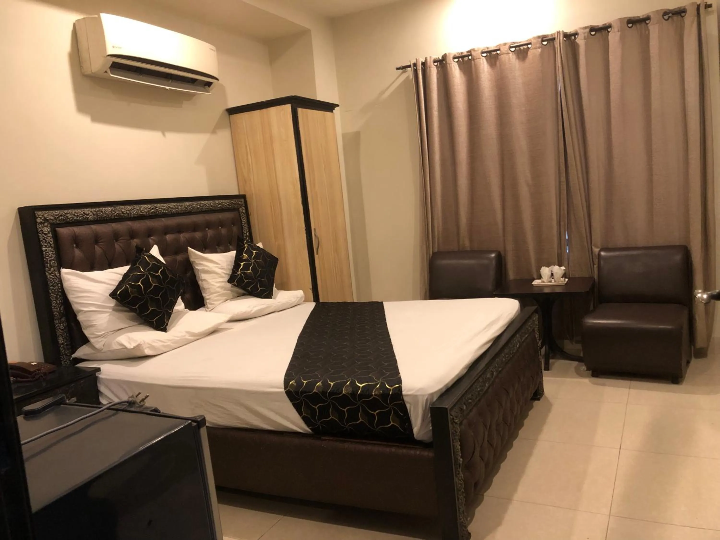 Bed in Hotel Tulip Inn