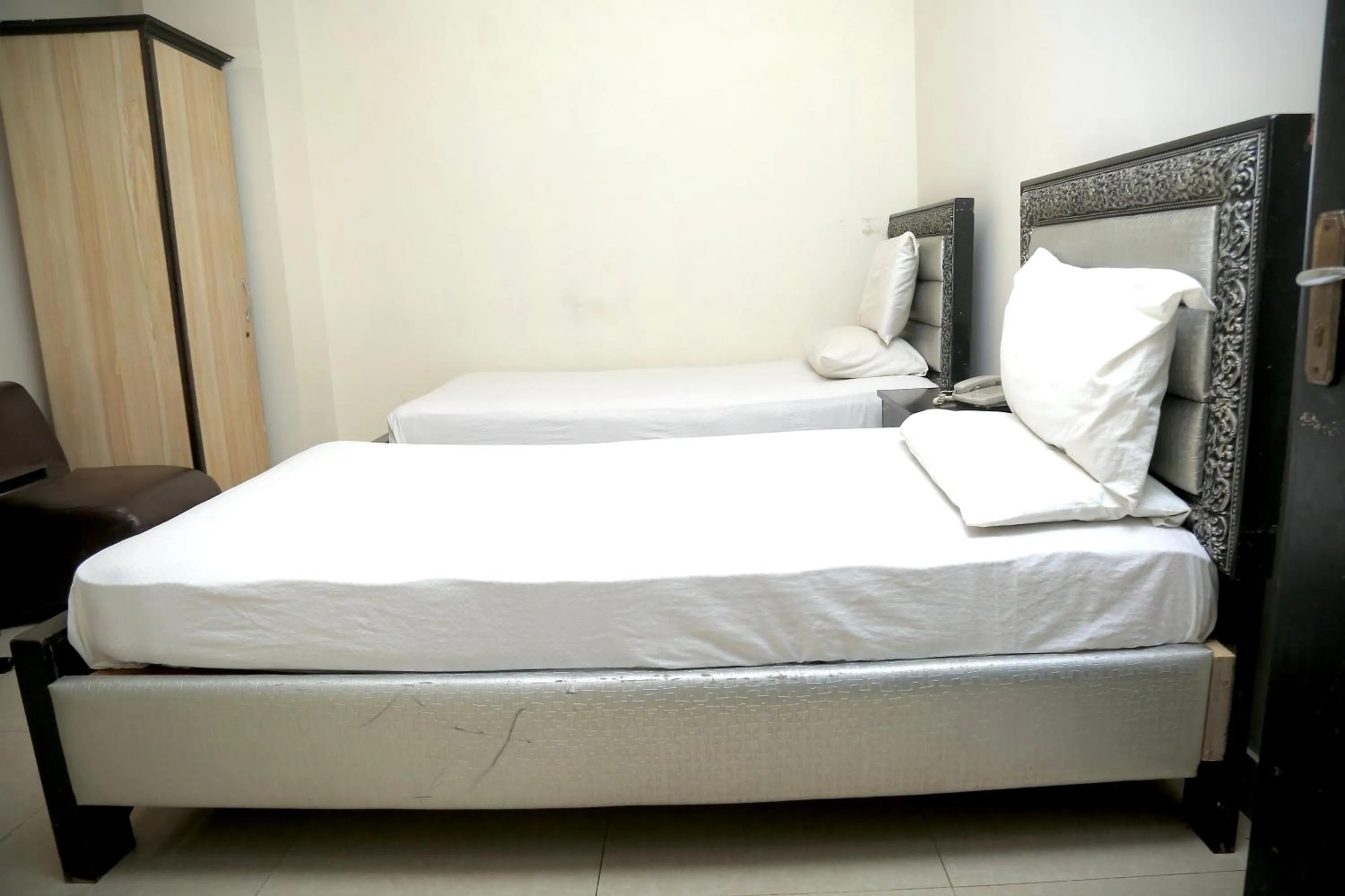 Bed in Hotel Tulip Inn