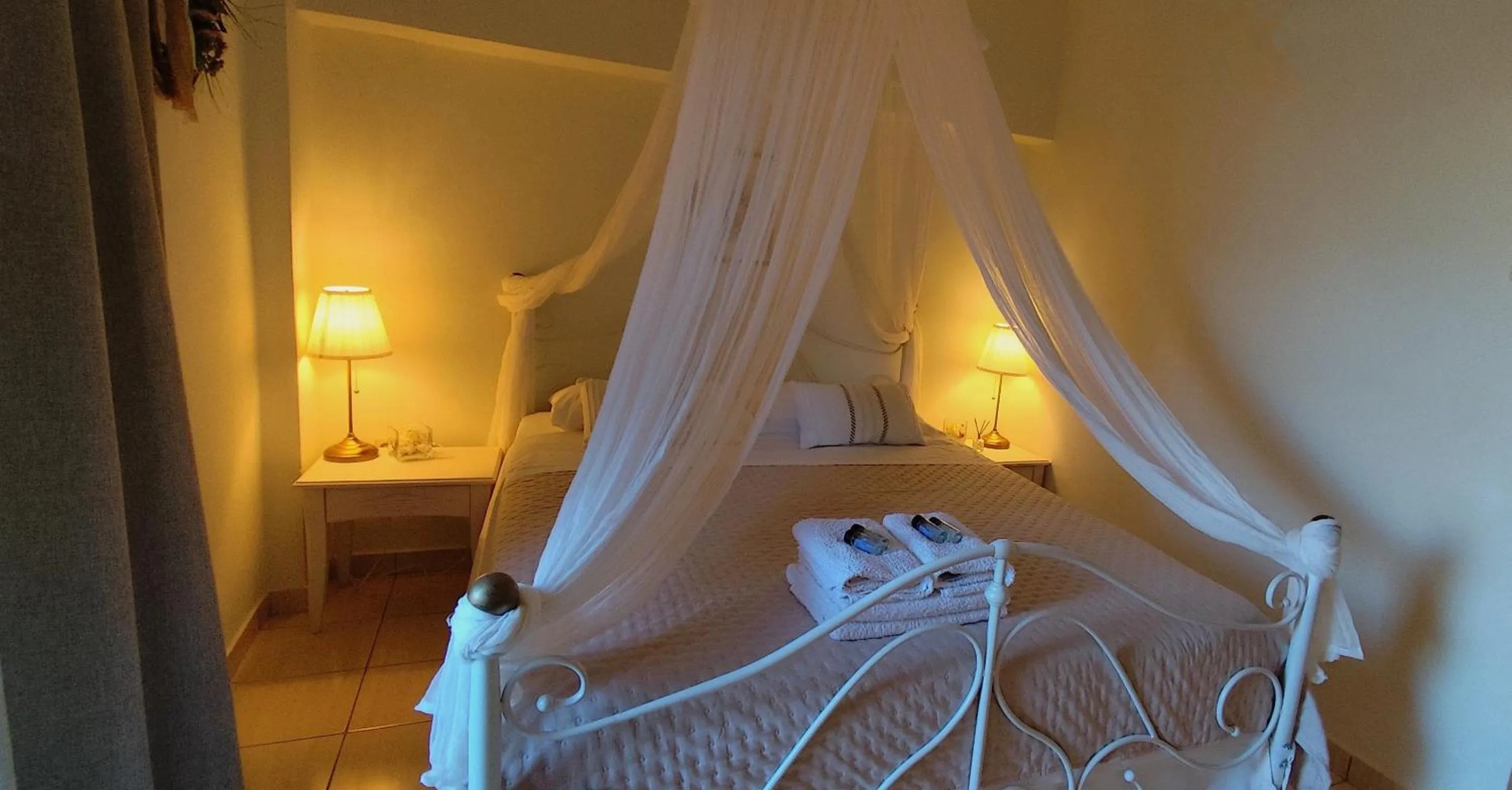 Bed in Niki Apartments