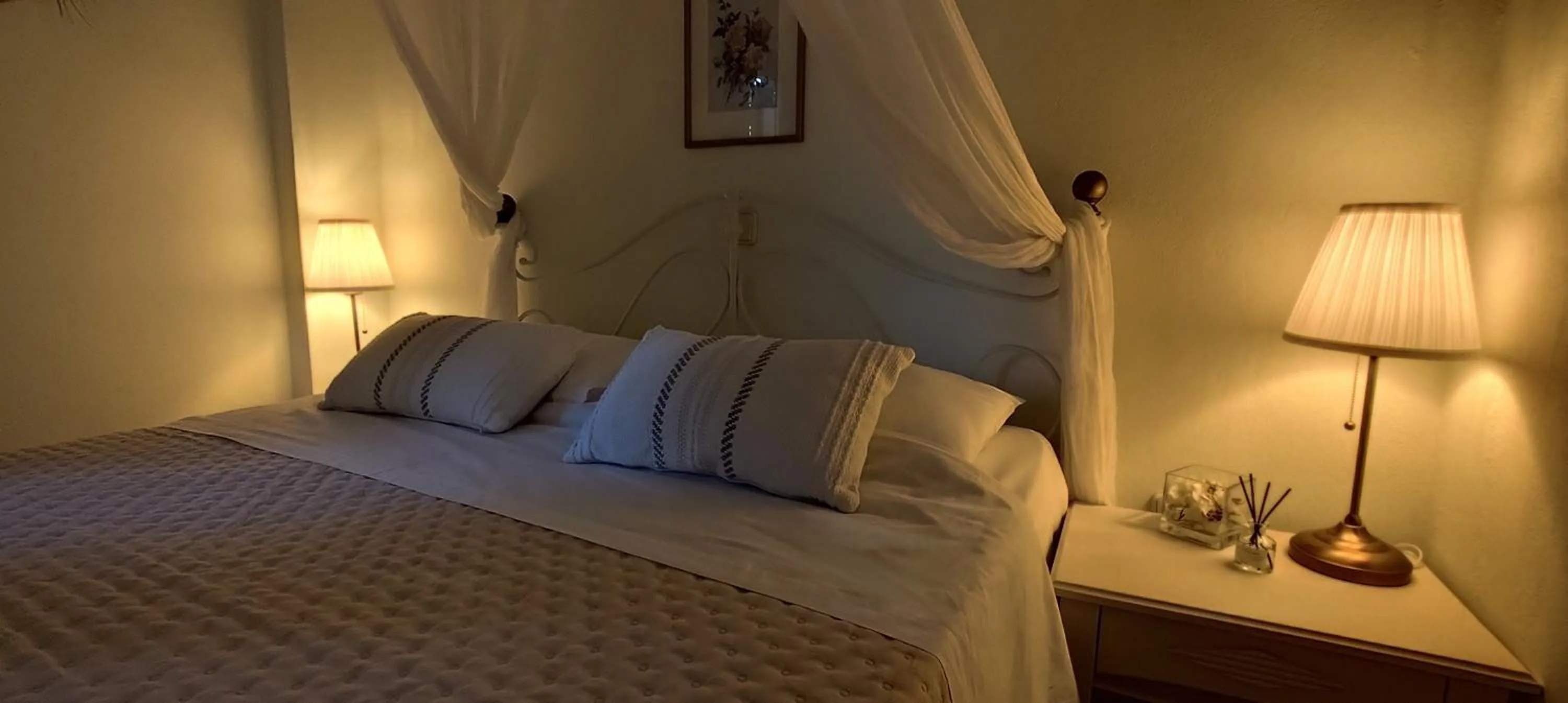 Bed in Niki Apartments