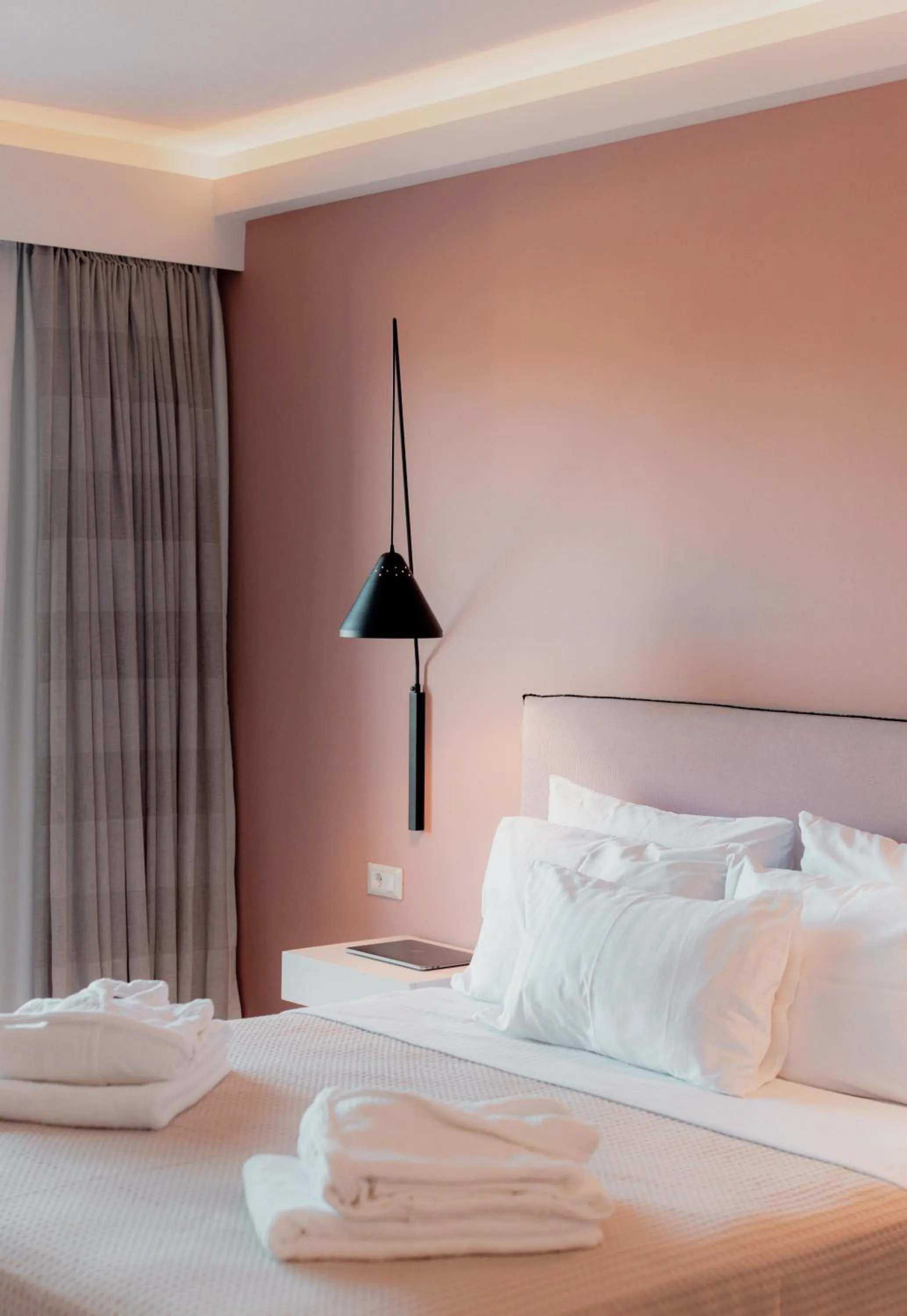 Bed in Palacio del Sol Luxury Apartments