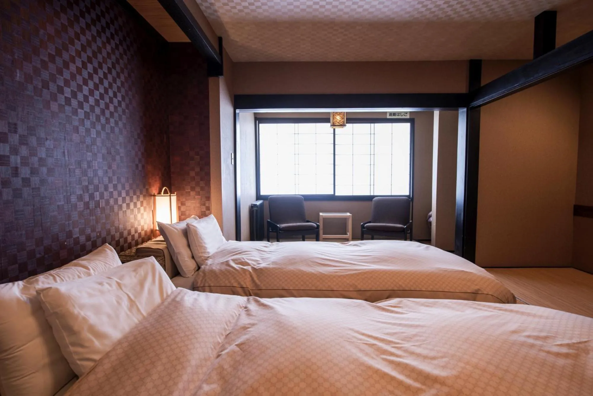 Bed in Takamiya Ryokan Miyamaso