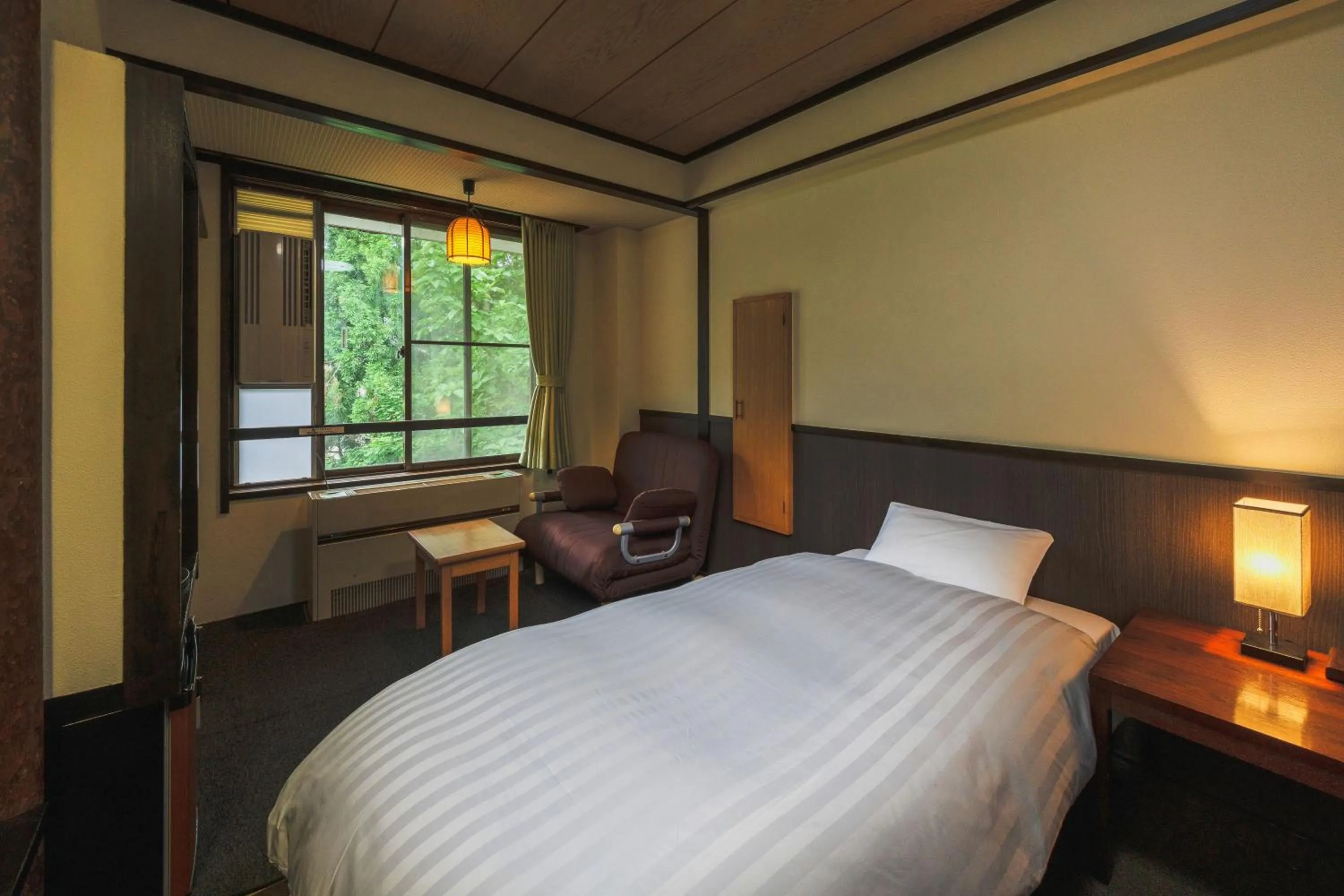 Bed in Takamiya Hotel Hammond