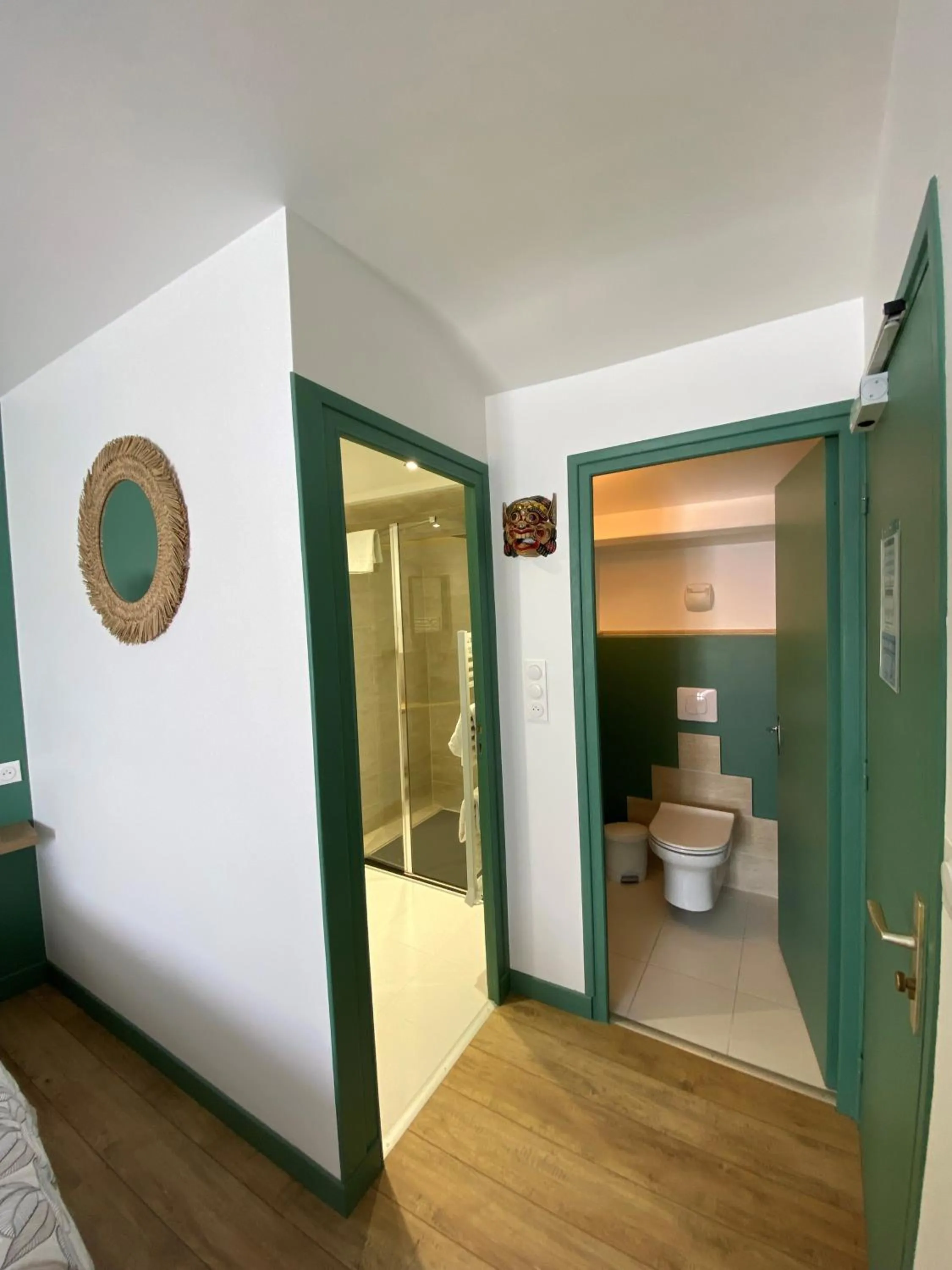 Bedroom in Hôtel Restaurant Le Grillon