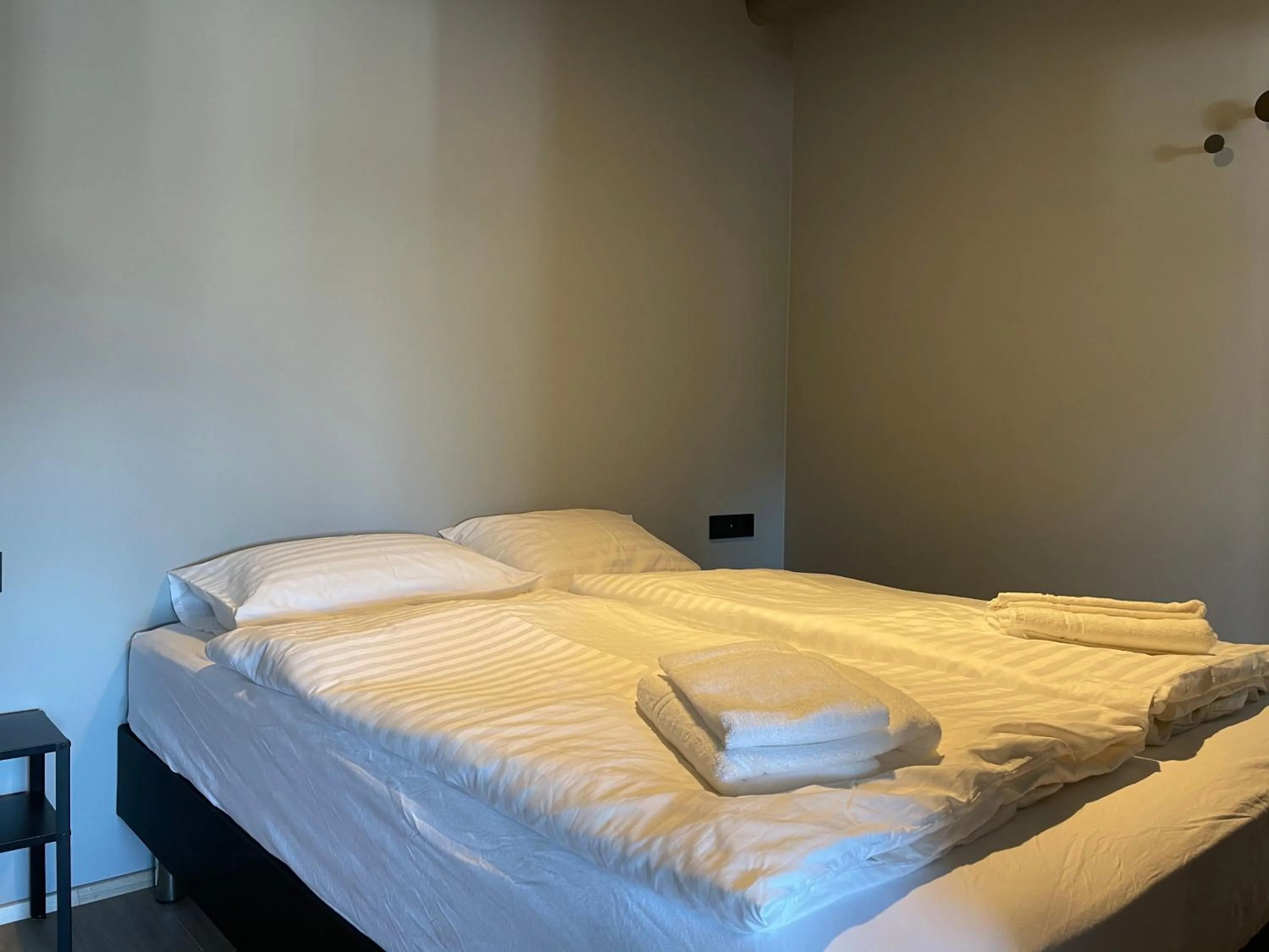 Bed in North Apartments Suites