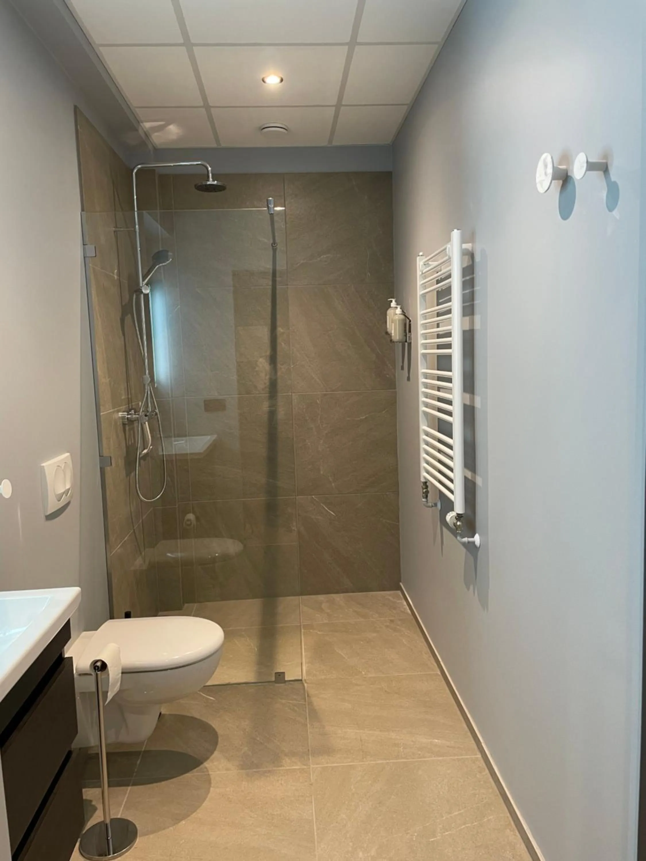 Toilet in North Apartments Suites