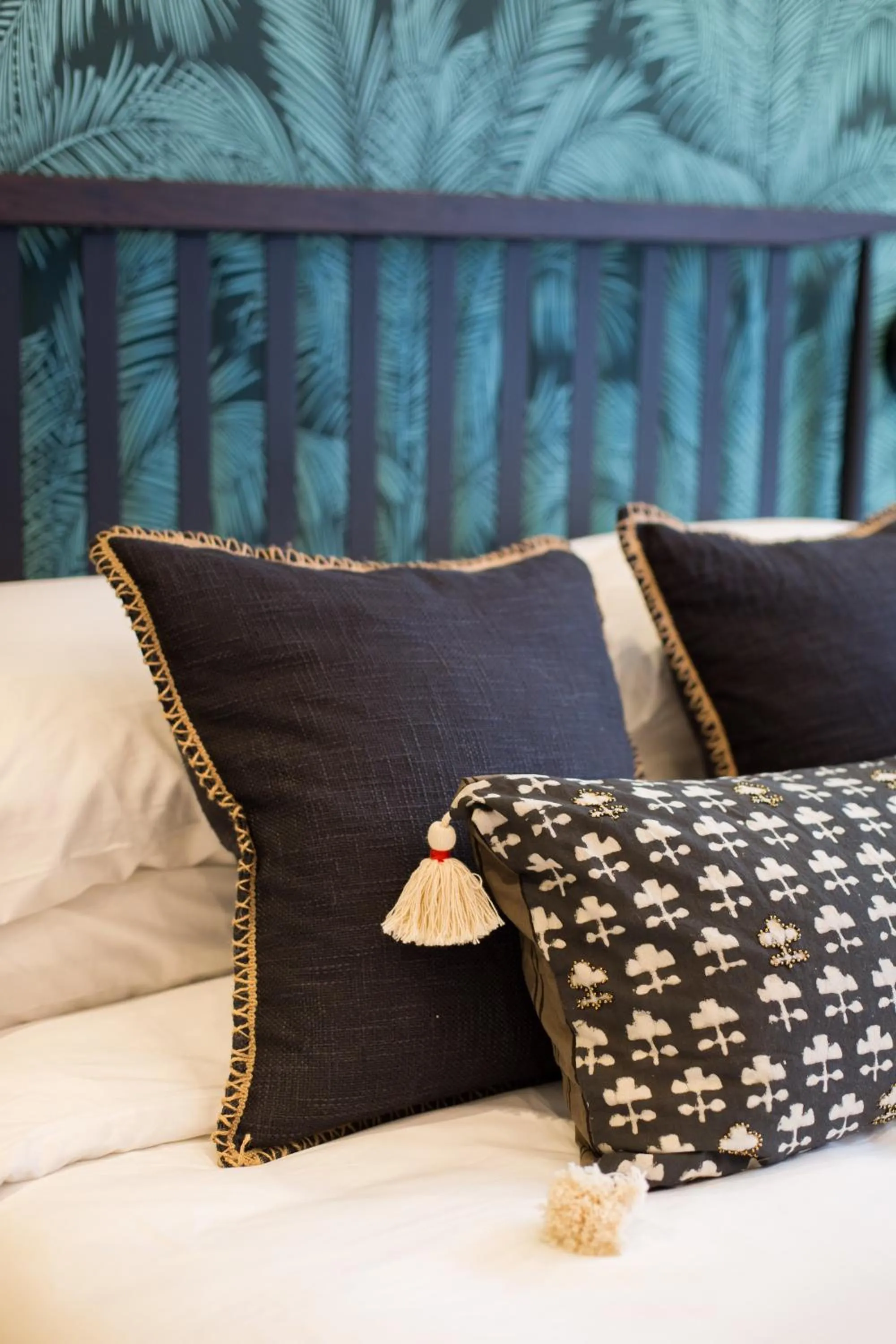 Bed in Blue Tropics Studio in Little Italy with kitchen by Den Stays