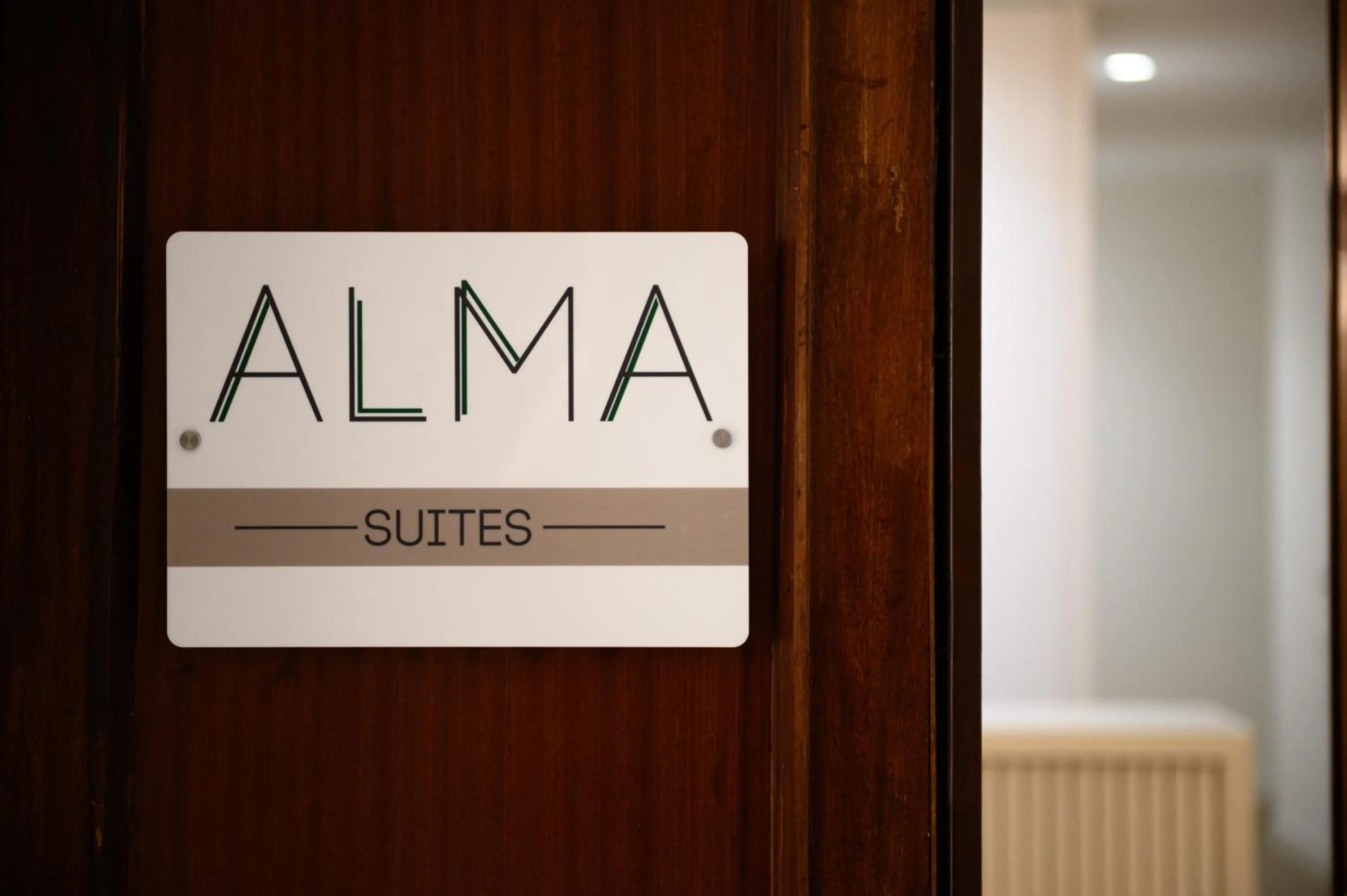 Property logo or sign in Alma Suites